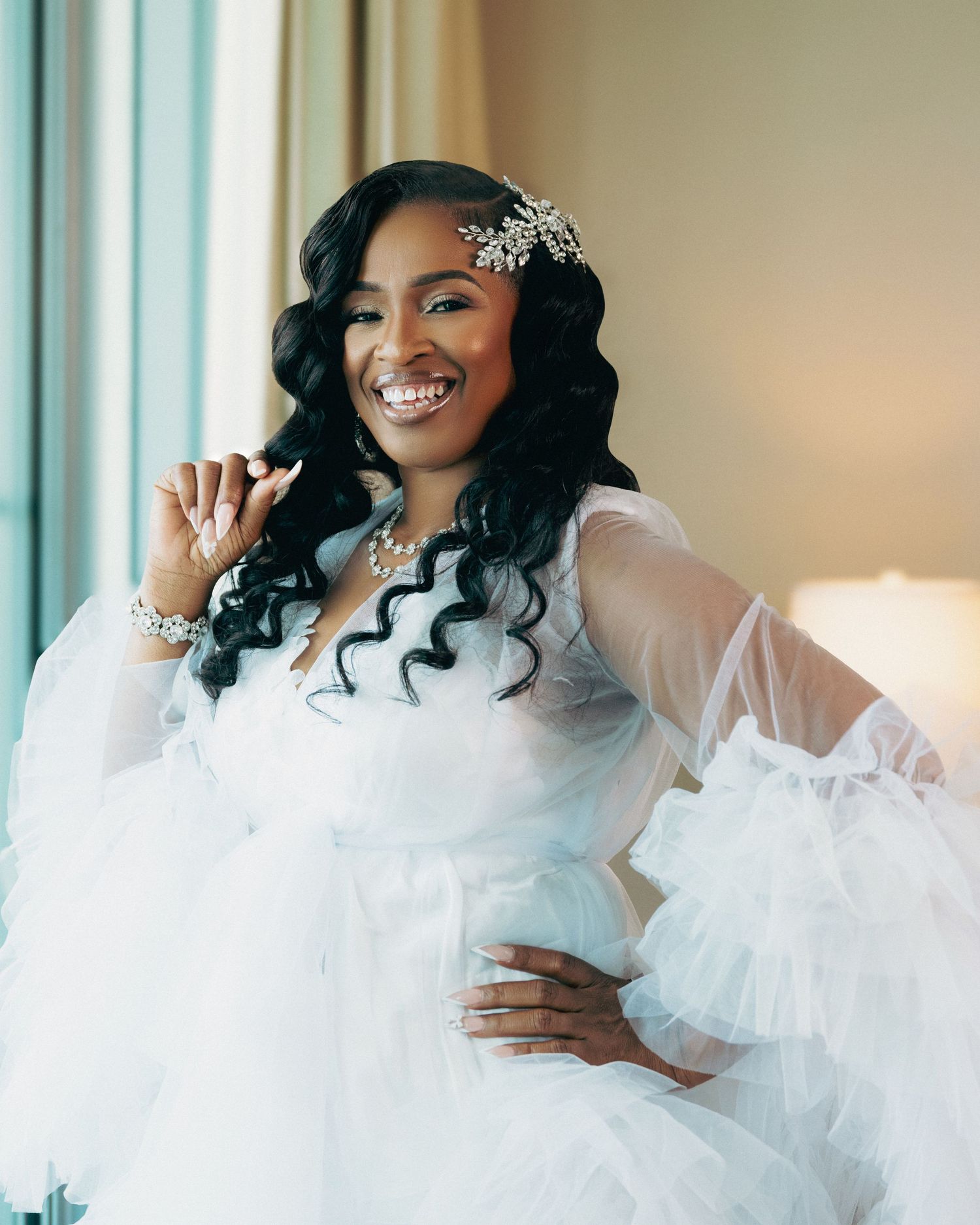 Bride in white ruffled dress smiles and poses in a series of joyful portraits.