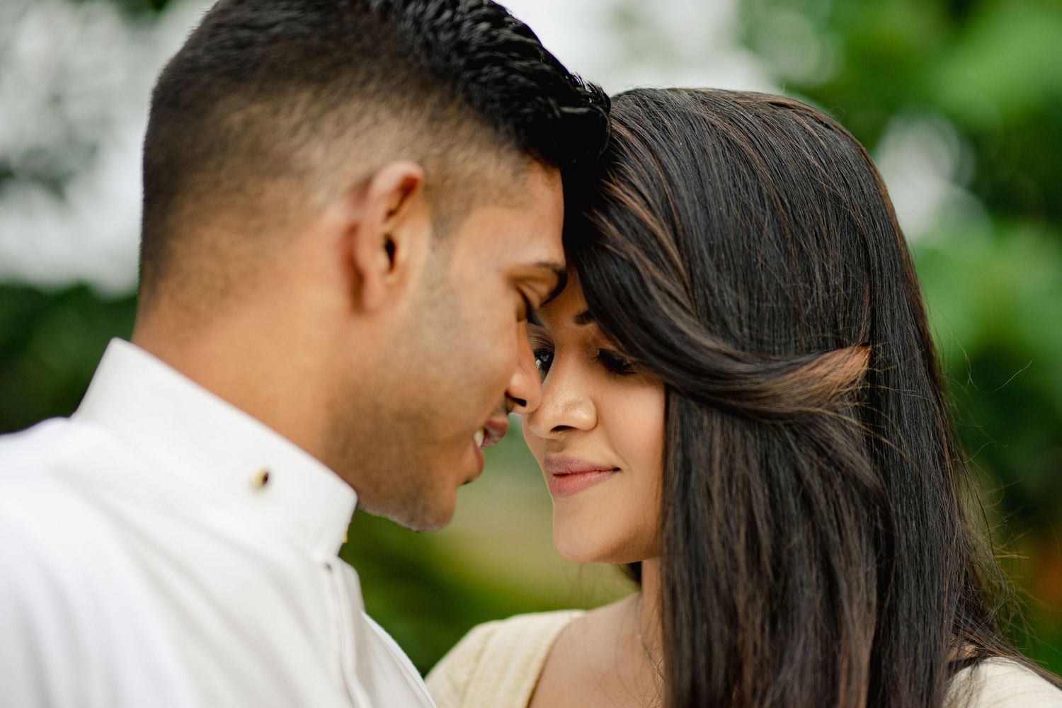 Intimate couple portraits captured in soft natural lighting outdoors.