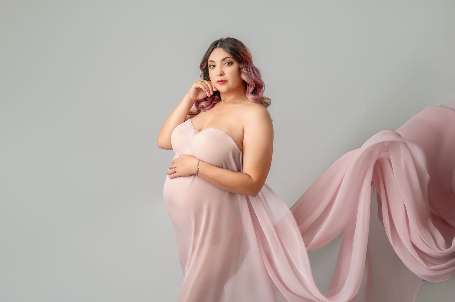 Fine art maternity portrait photographed in studio serving Visalia and Central Valley families.