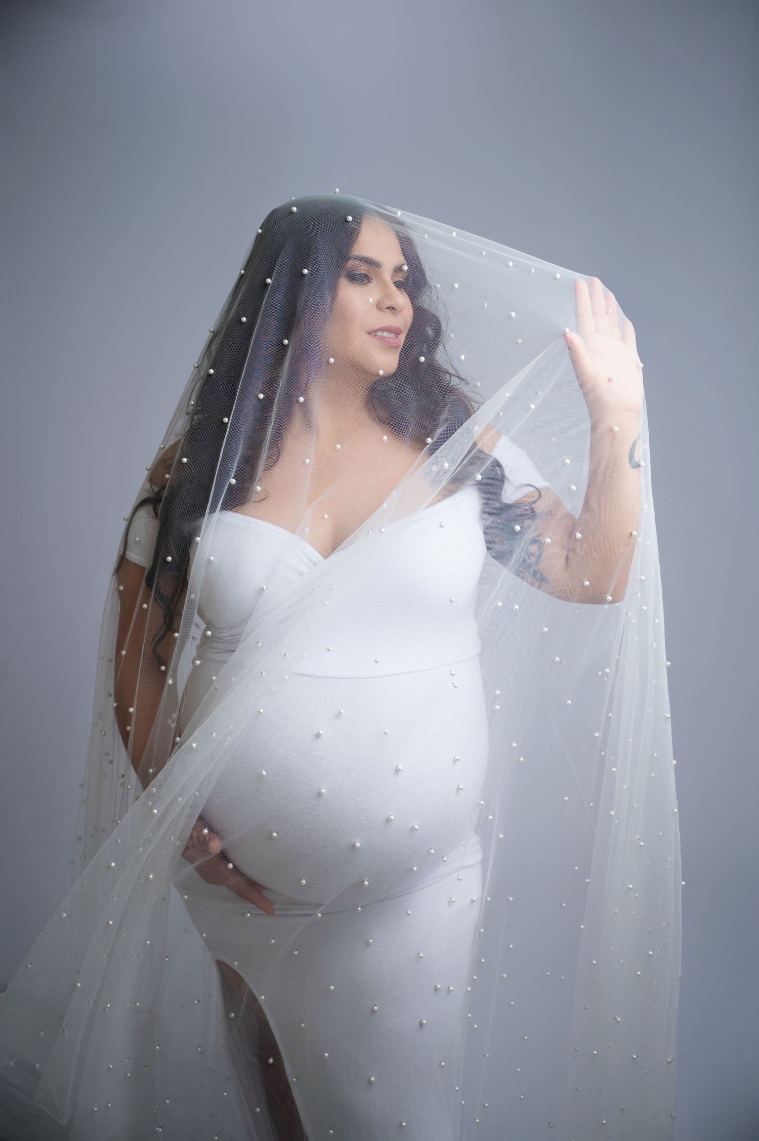 A beautiful bridal inspired maternity portrait taken by Fresno maternity photographer Christina Baltazar