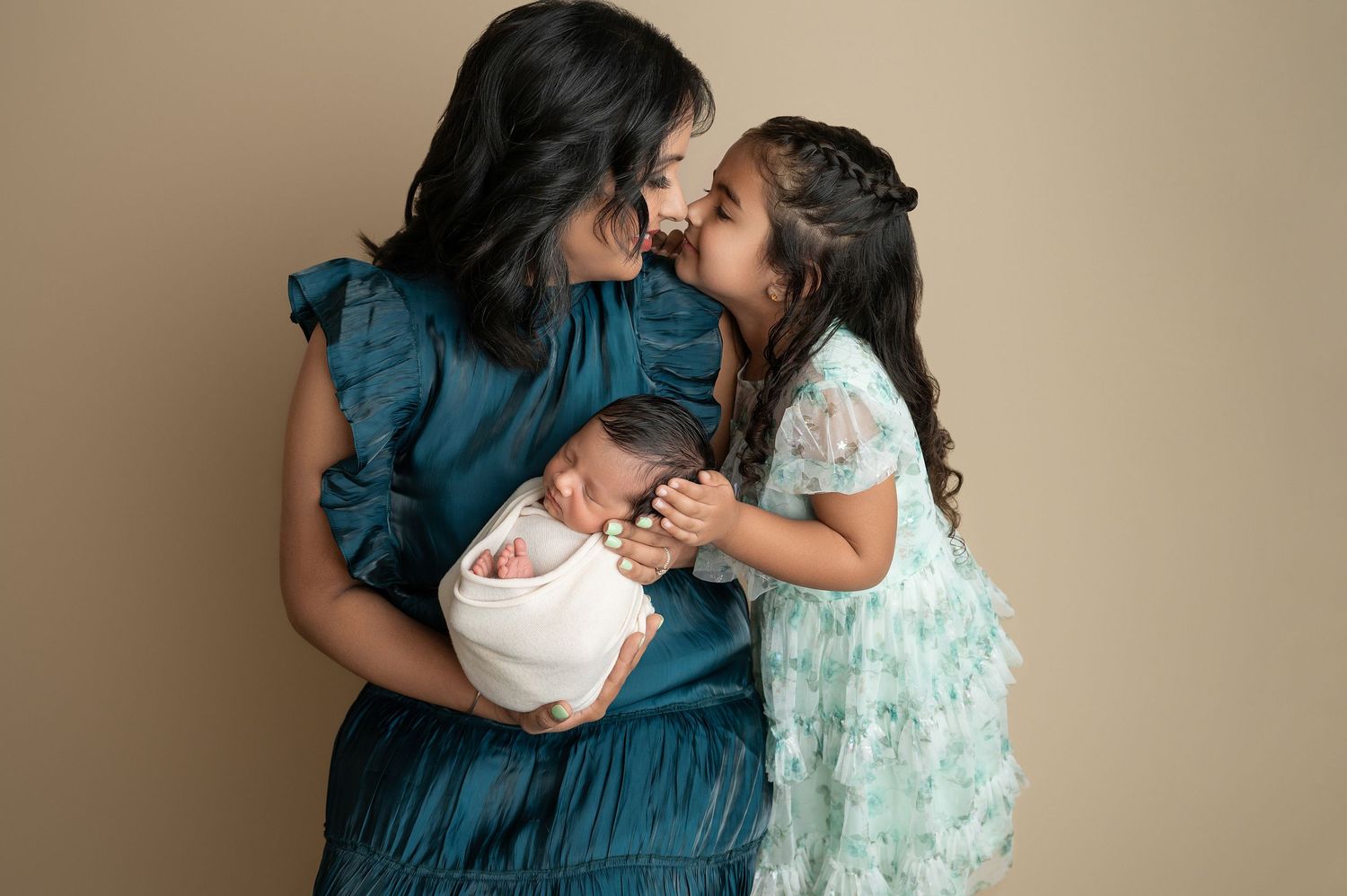 Sweet family photography series showing loving interactions in neutral tones.