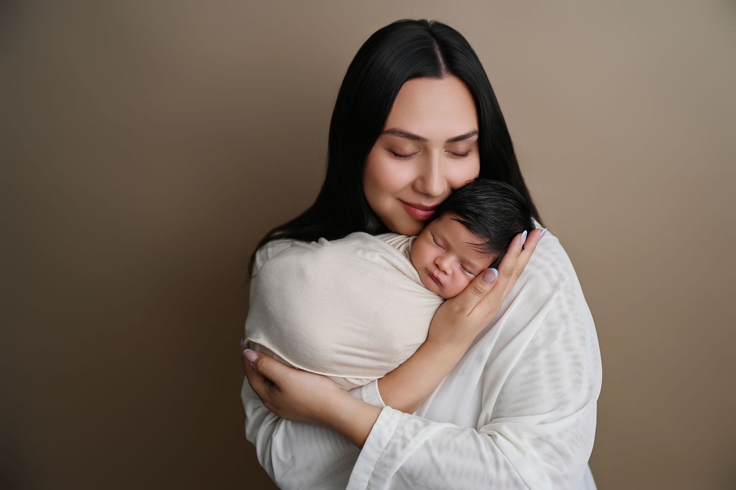 Tender black and white maternity portraits showing emotional moments.