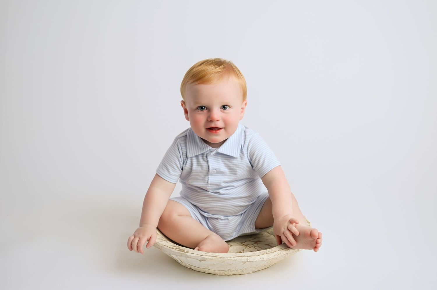 Baby milestone photos showing growth from newborn to sitting stages on white background.