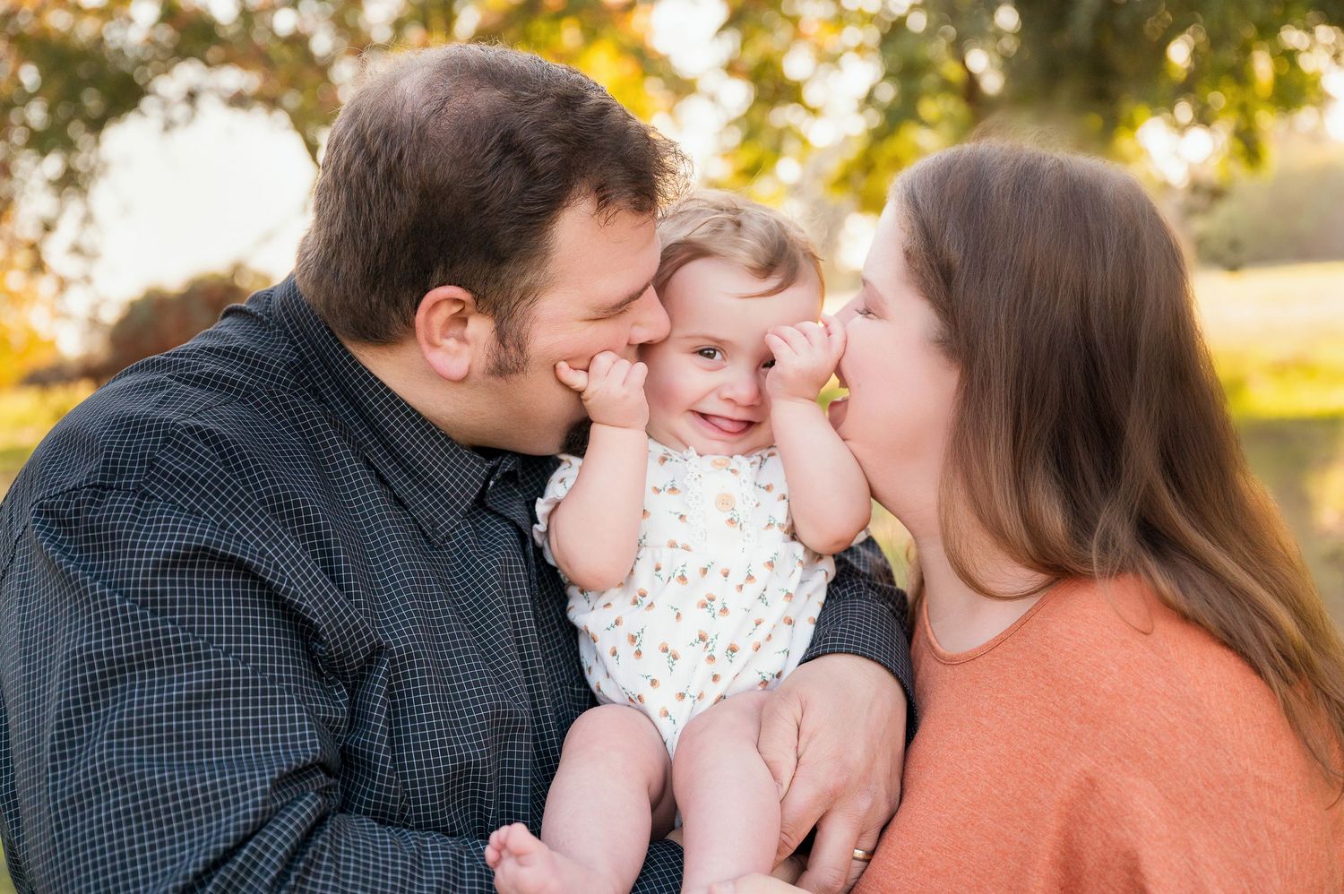 Family members share joyful candid moments together during sunset portrait session. Hanford Family Photographer