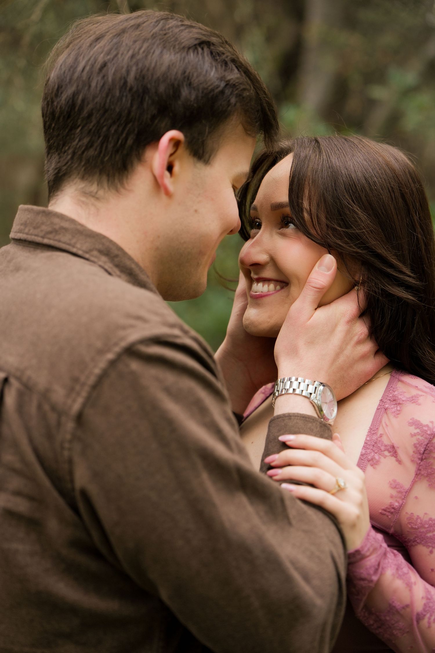 A romantic sequence showing a couple in an intimate embrace outdoors, with the man wearing brown and woman in pink.
