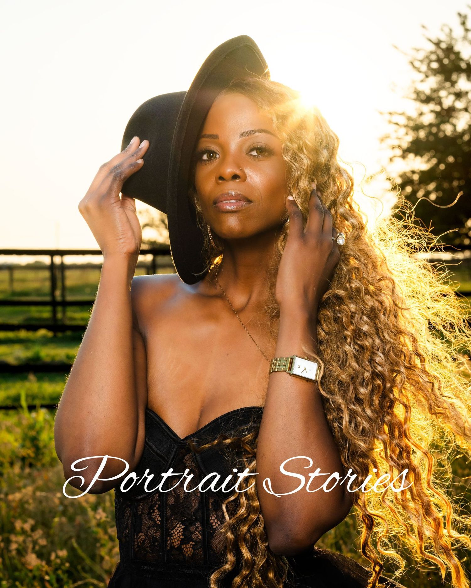 Golden sunset portrait session in a rustic outdoor setting with backlit curly hair creating a warm ethereal glow.