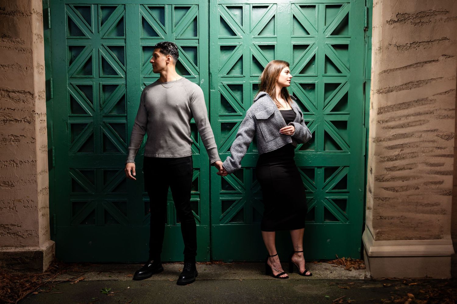 A series of four connected images showing dancers performing expressive movements against a green door and brick wall.