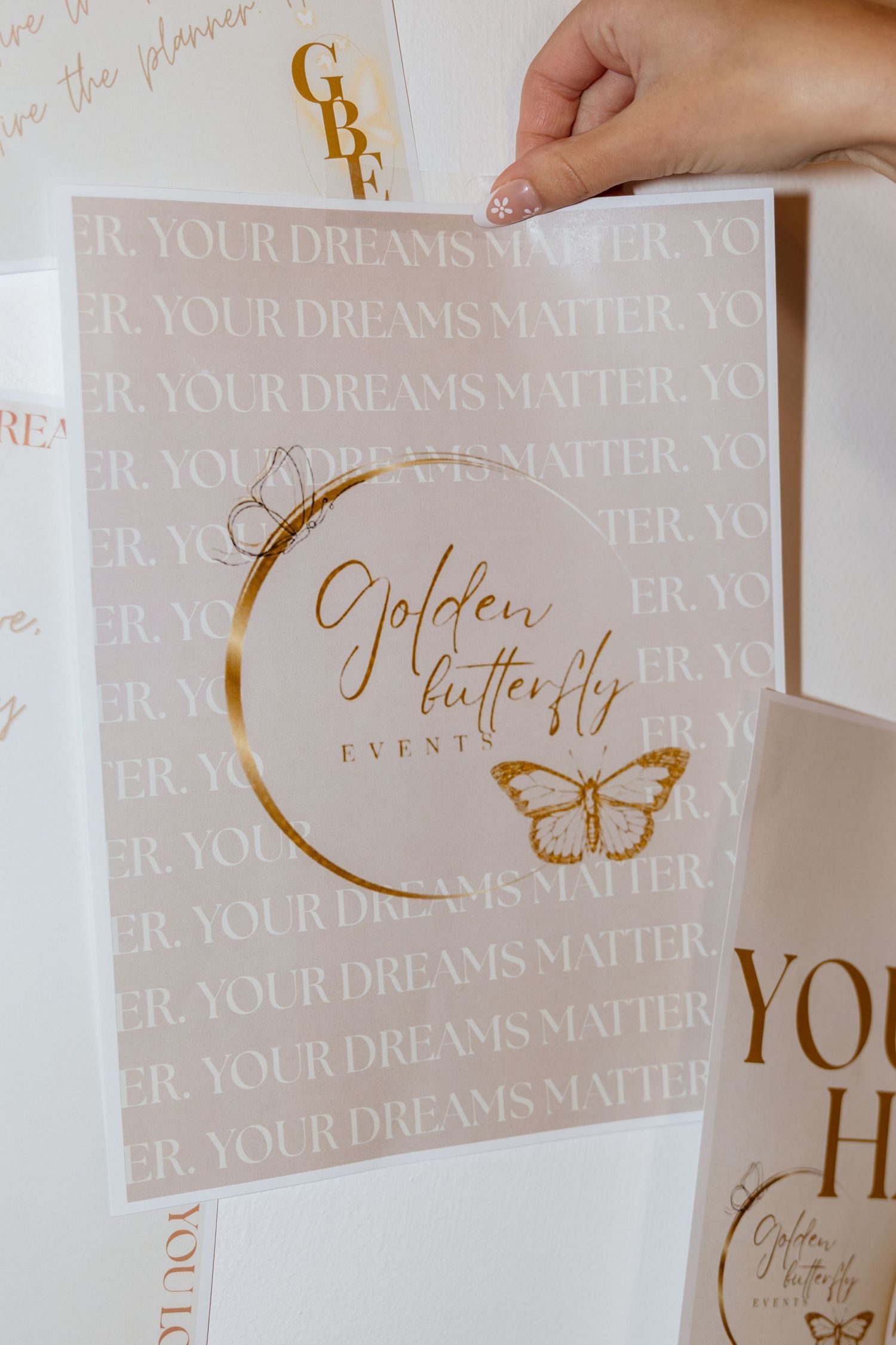 Golden Butterfly Events branded stationery with gold foil logo and 