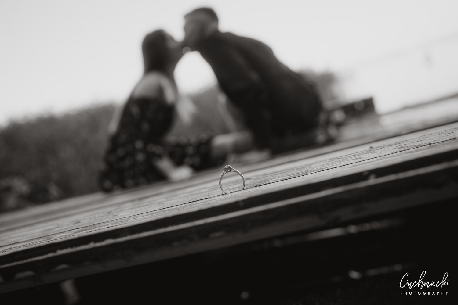 Artistic black and white silhouette photograph on a textured surface.