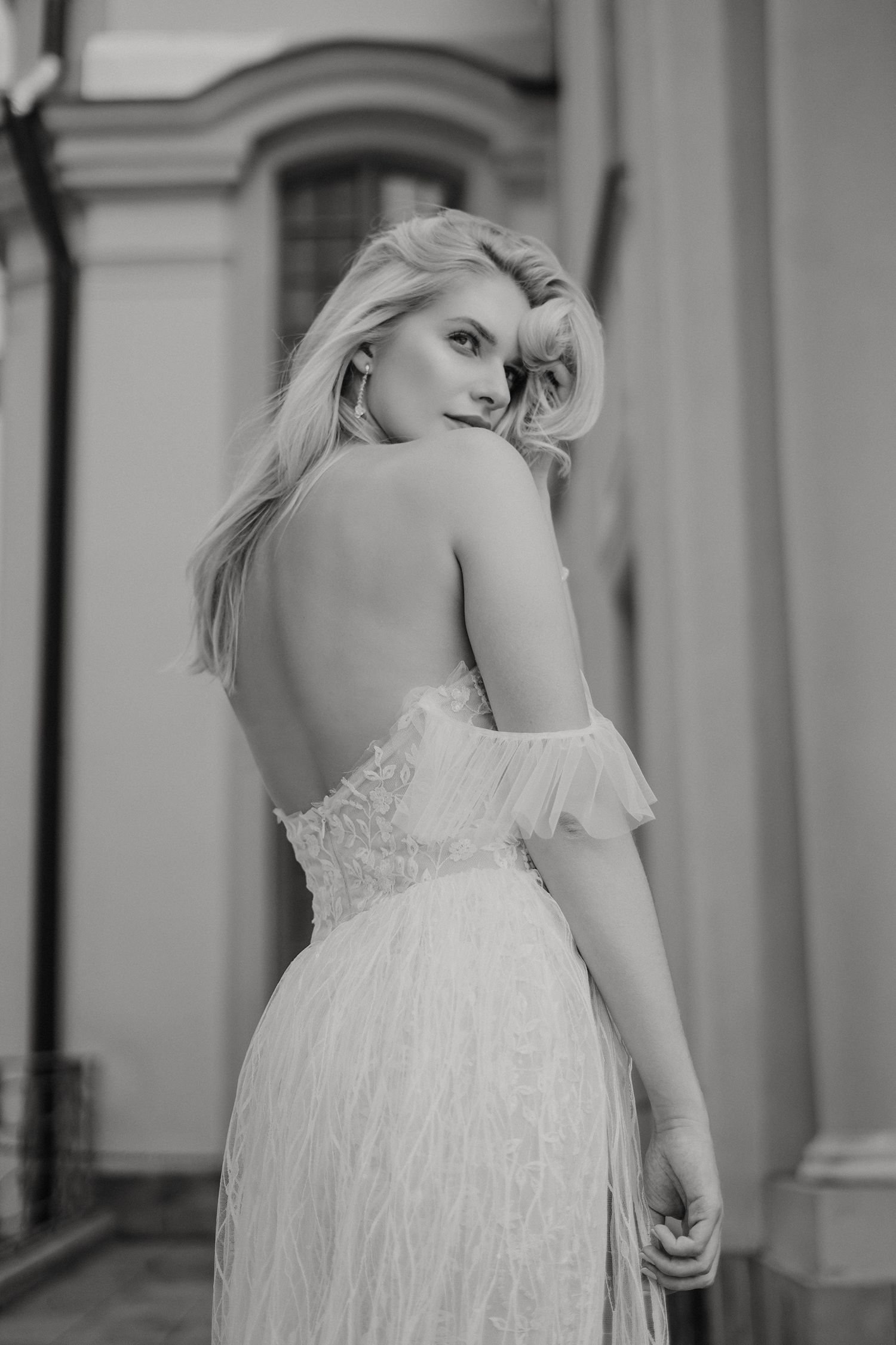 A bride in a white textured gown is shown in a series of black and white photos from different angles.