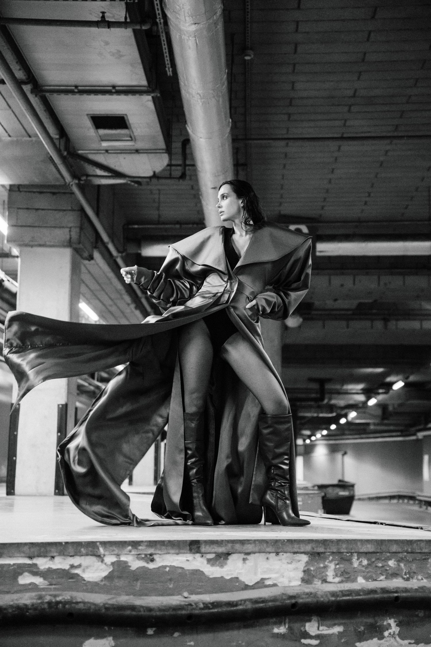 Black and white photos show a skateboarding sequence of tricks performed in an underground parking garage.