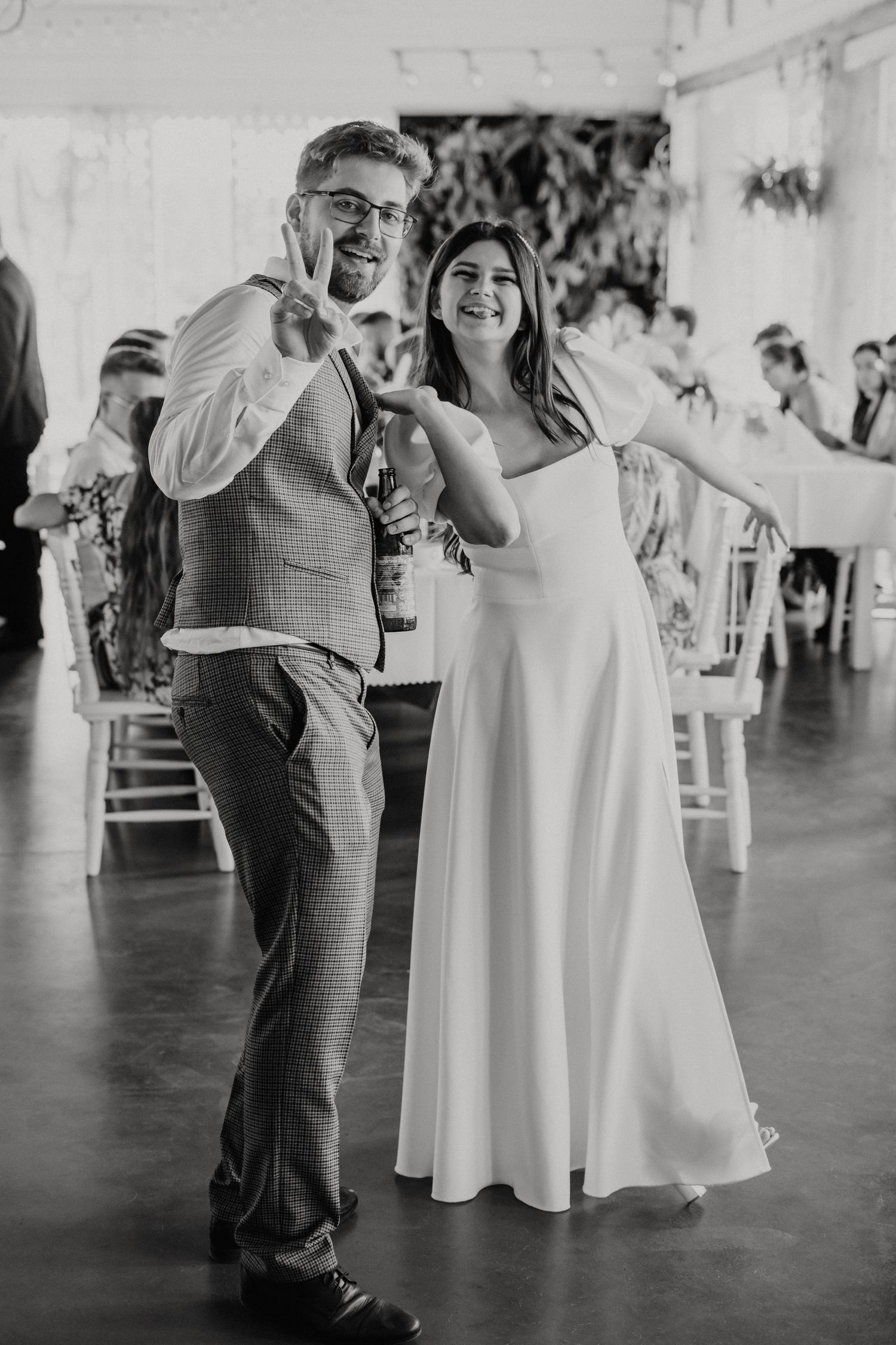 Black and white photo of wedding reception dancing and celebration.