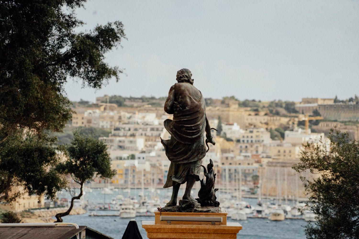 Harbor view with boats and traditional architecture visible along the waterfront.