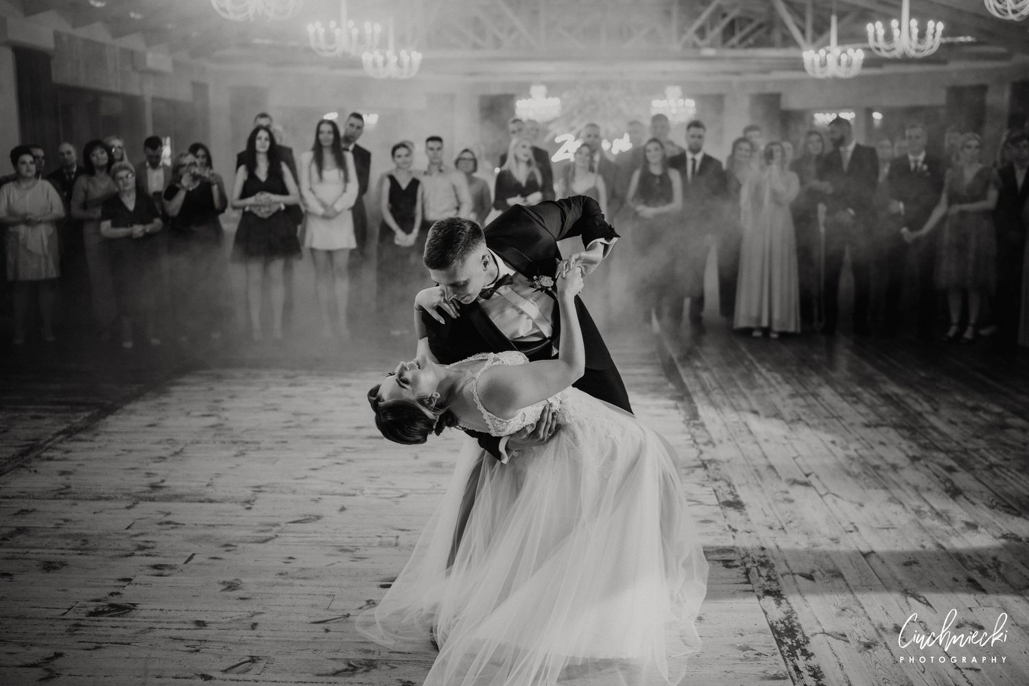 Black and white images of a couple's first dance at their wedding reception.