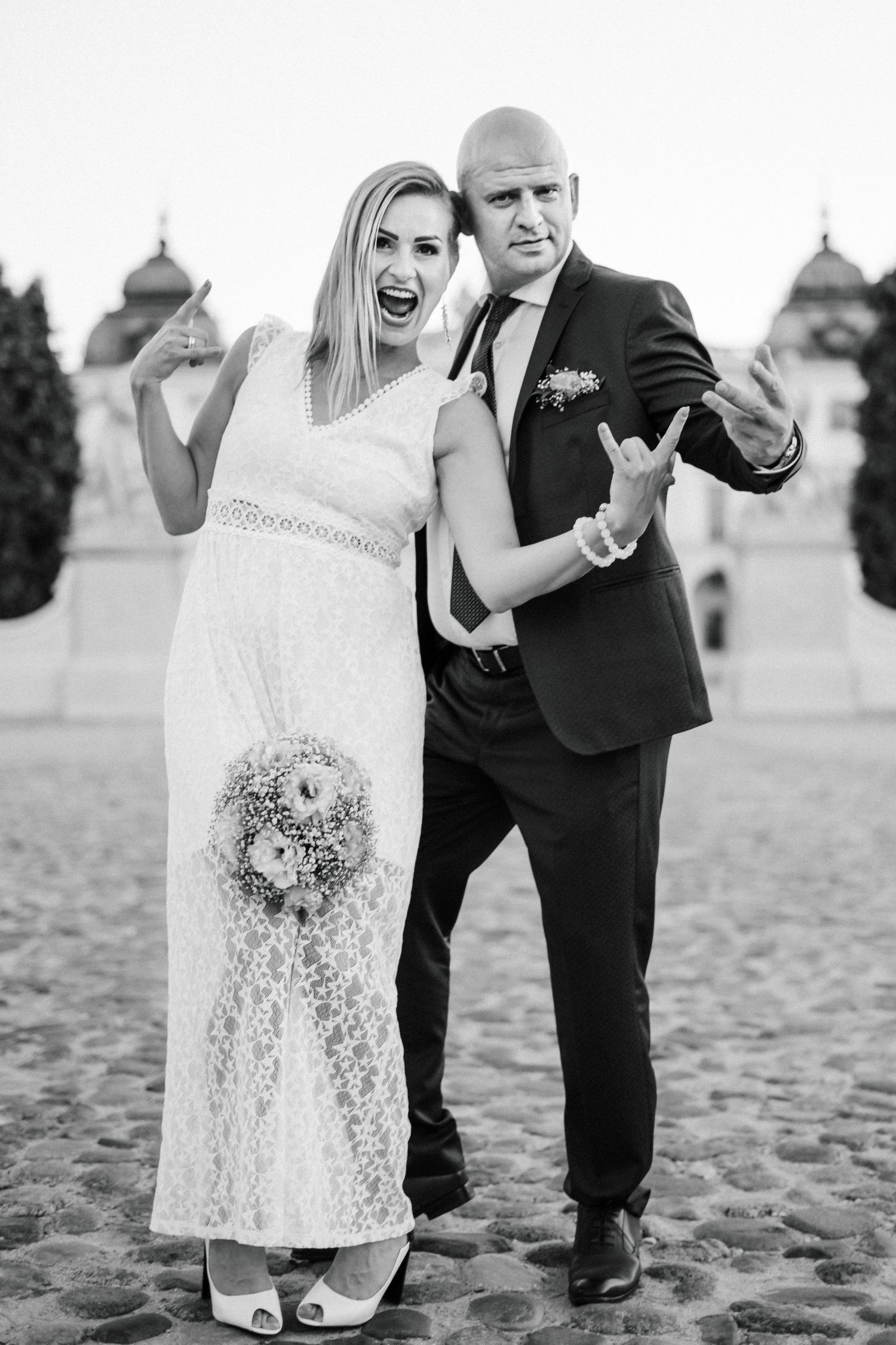 Black and white beach photos showing a couple in wedding attire.