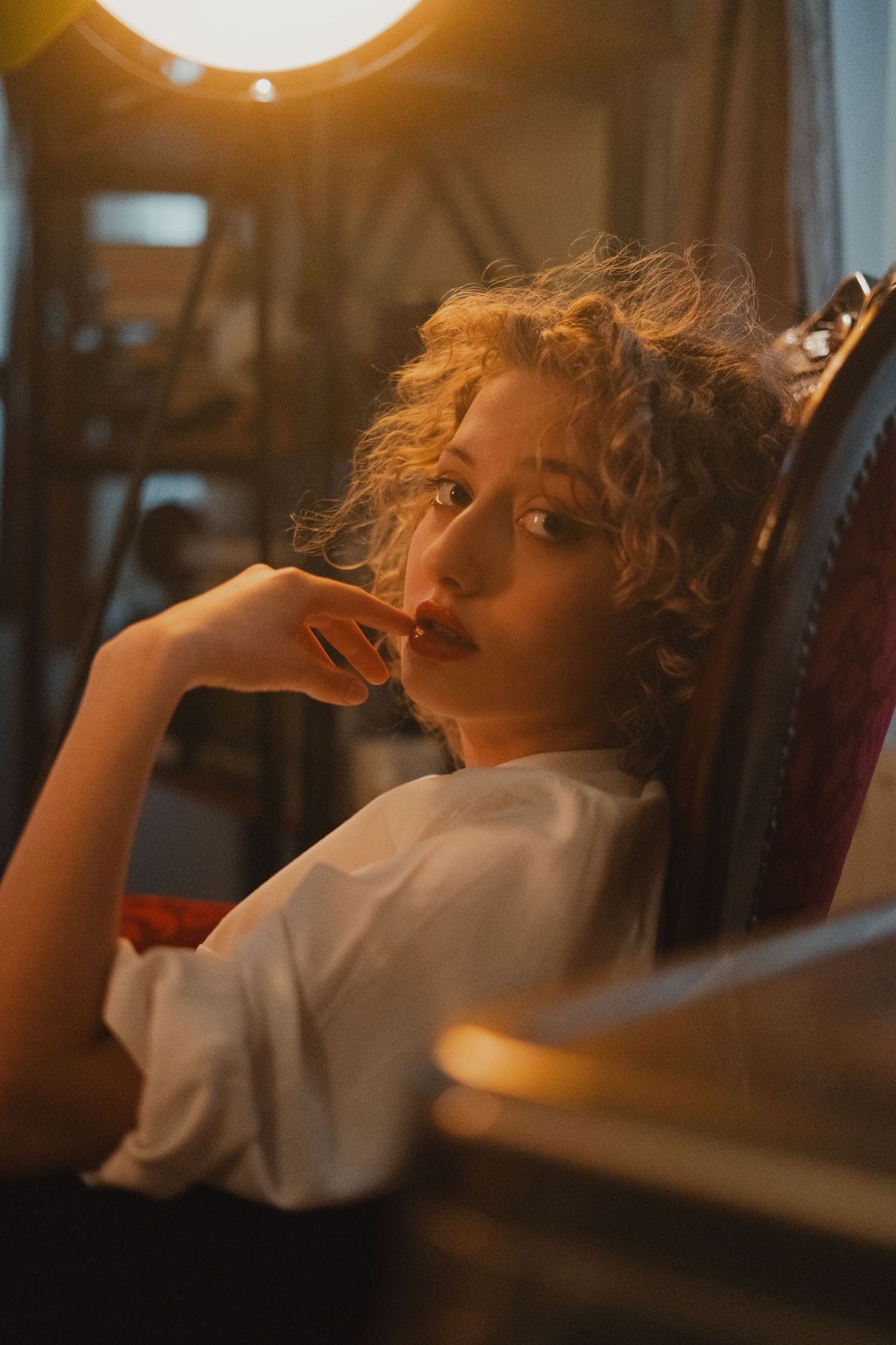Atmospheric portrait in warm lighting with vintage aesthetic.
