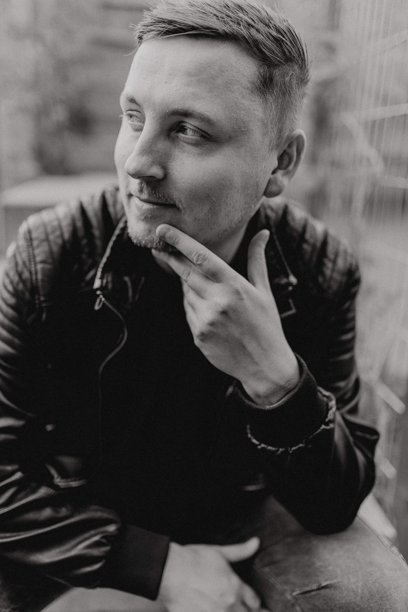 A black and white photo series shows someone wearing dark clothing looking thoughtfully to the side.