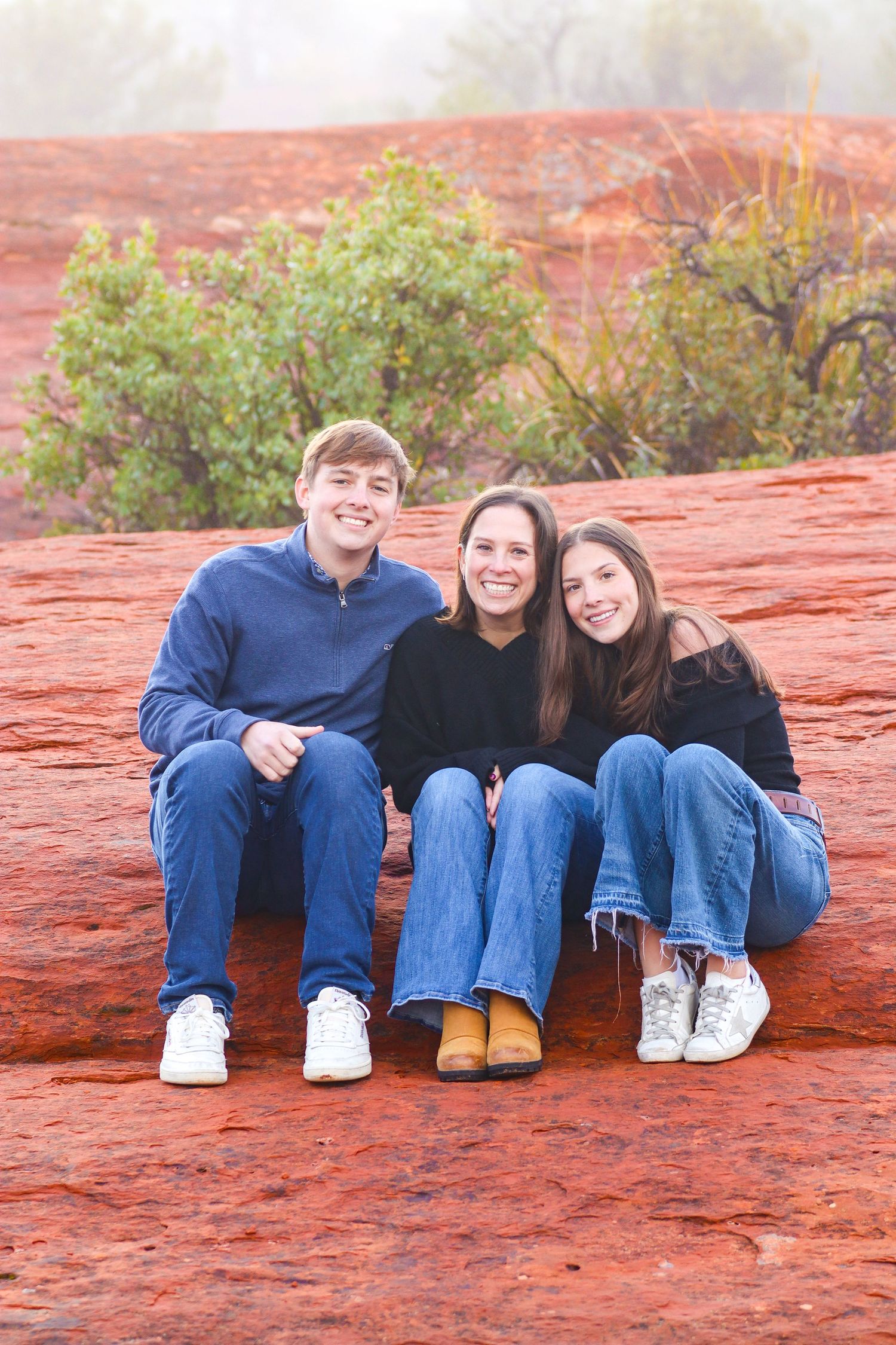 A series of photos showing three people sitting together on red sandstone rocks in an outdoor desert landscape.