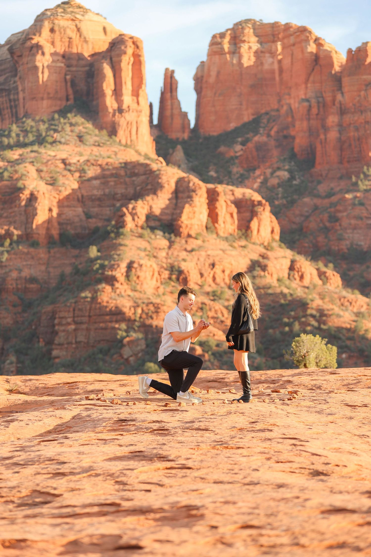 A sequence of proposal photos captured against dramatic red rock formations in Sedona Arizona.