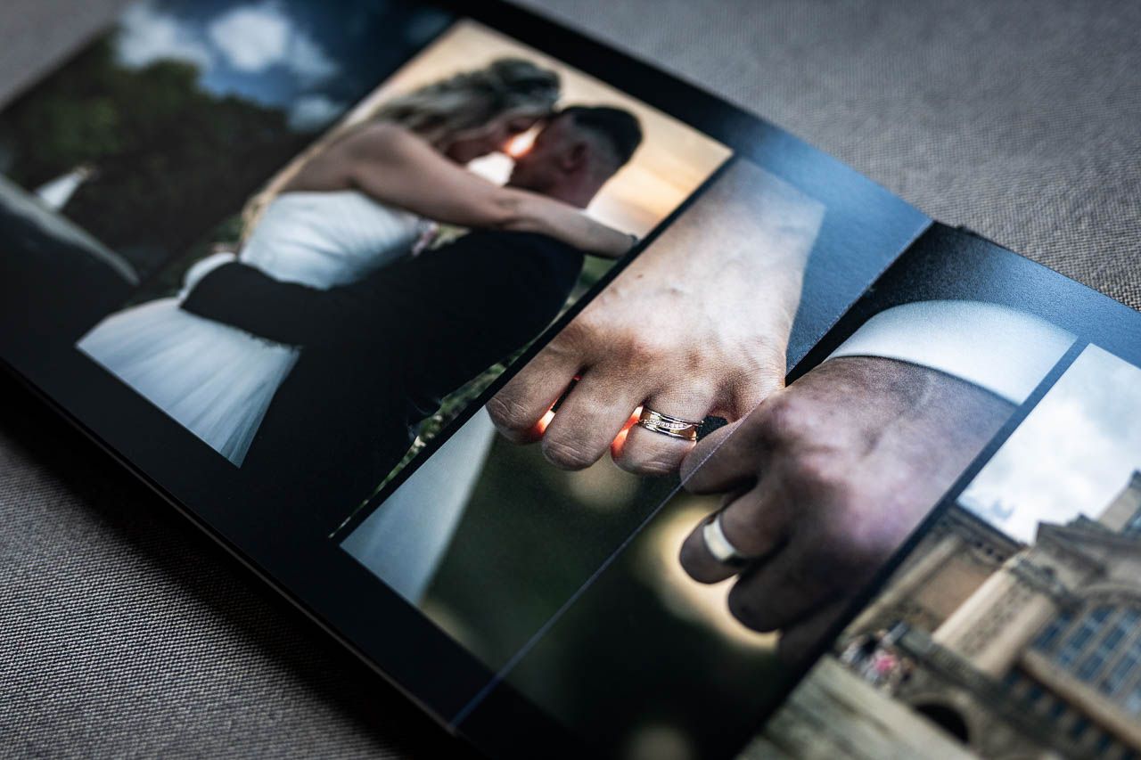Wedding photo album spread featuring artistic black and white photography layouts.