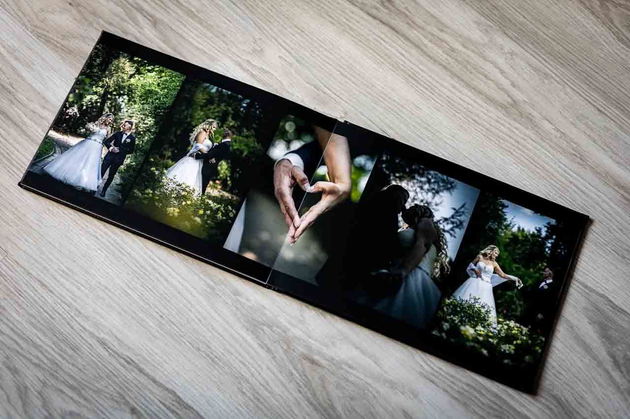 Wedding photo album layout showing multiple images arranged on wooden background.