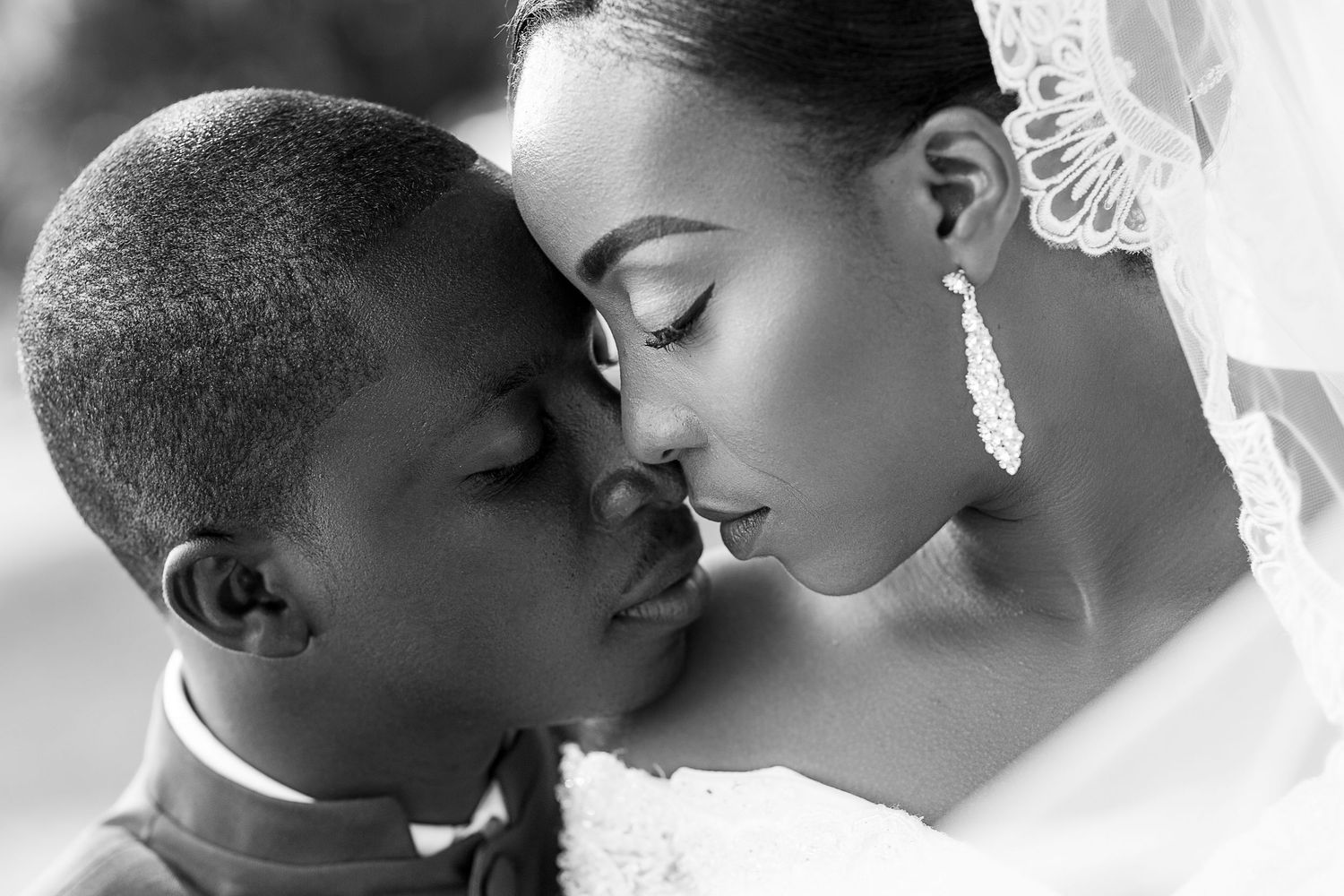 A series of intimate black and white portraits showing tender moments between newlyweds.