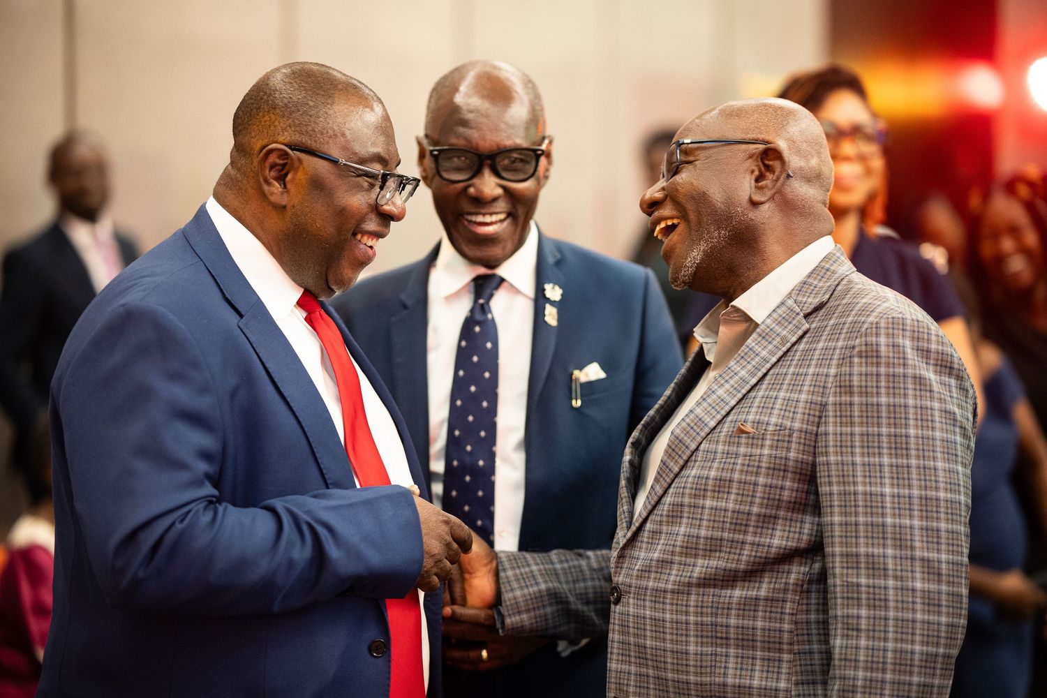 A series of candid photos showing people in formal attire interacting at what appears to be a social gathering or event.