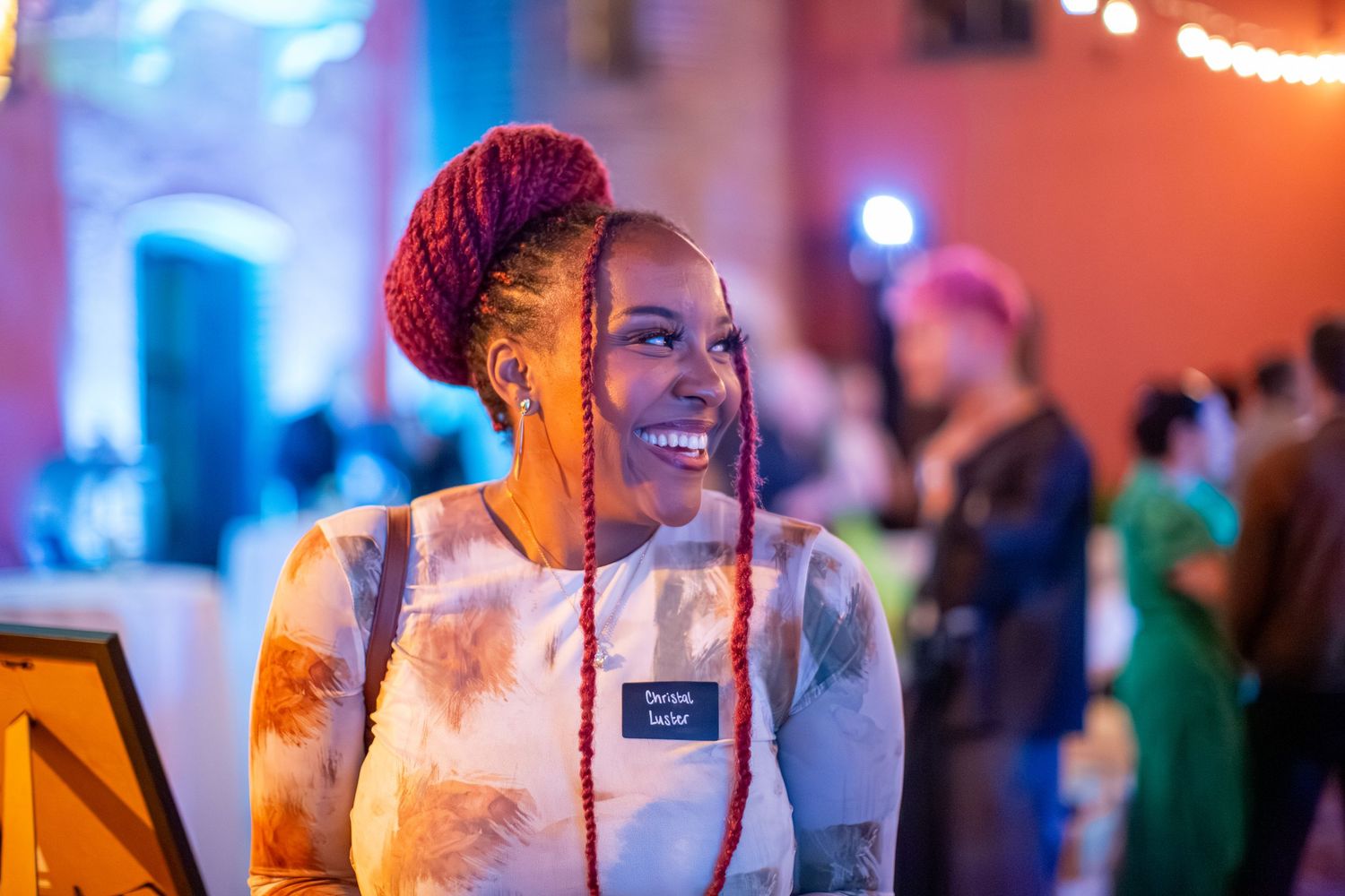 Candid event photography showing colorful lighting and festive atmosphere.