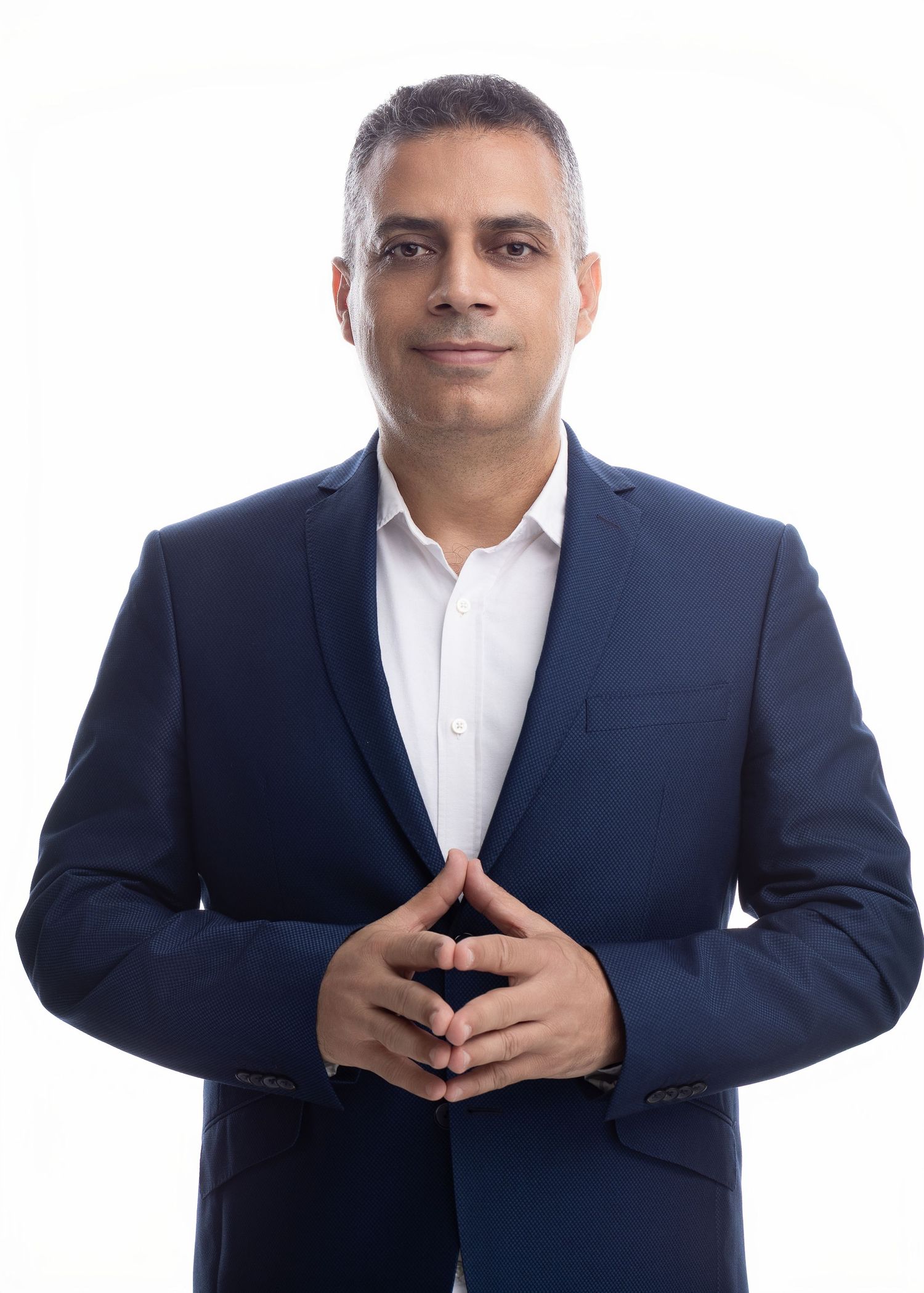 Corporate headshots in navy suit and white shirt against white background.