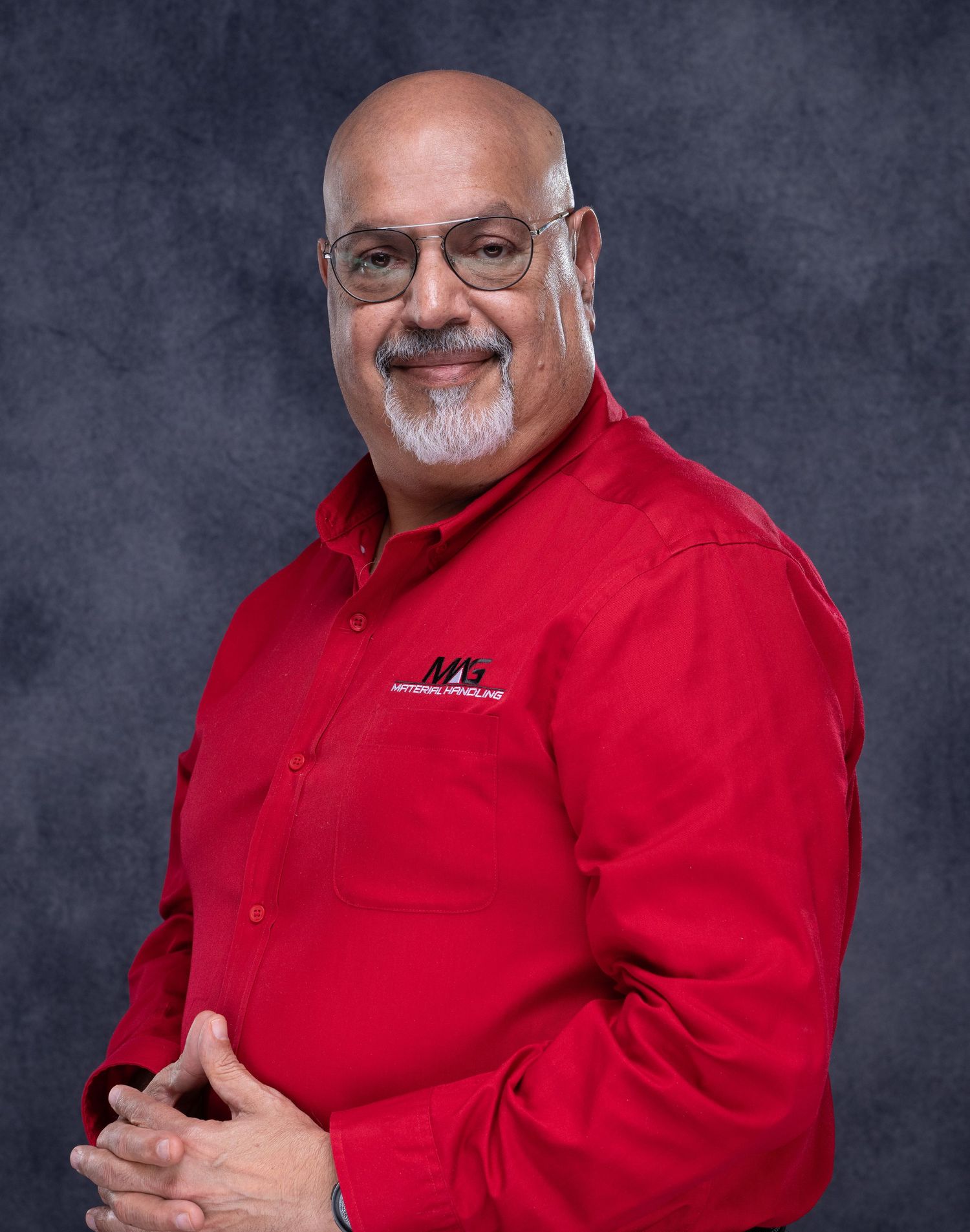 Professional portrait series of person in red polo shirt against gray background showing various angles.