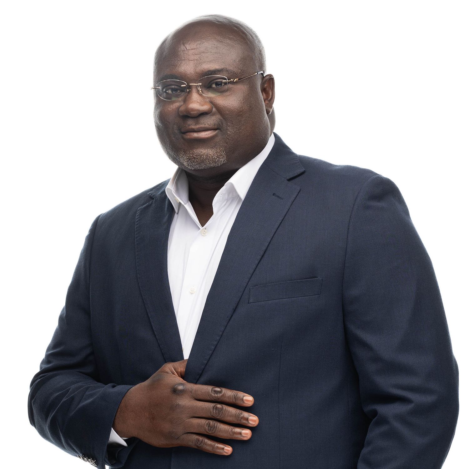 Business portrait series showing professional poses in dark suit and white shirt.