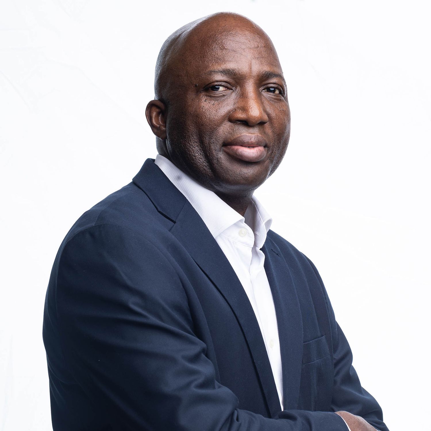 Series of business portraits showing different poses in formal attire against white backdrop.