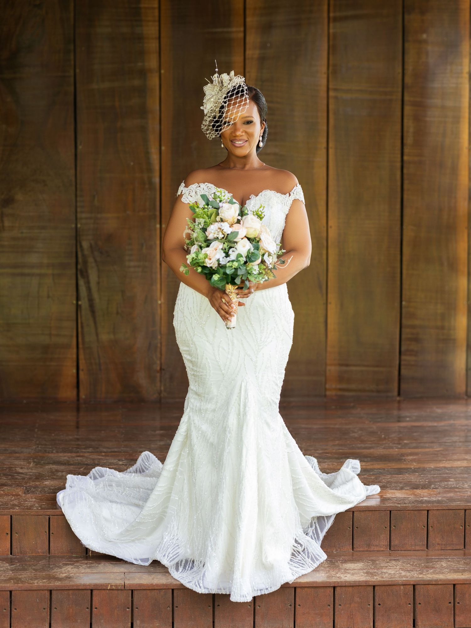 A series of bridal portraits showing a white lace wedding gown with sweetheart neckline and flowing train on wooden steps.