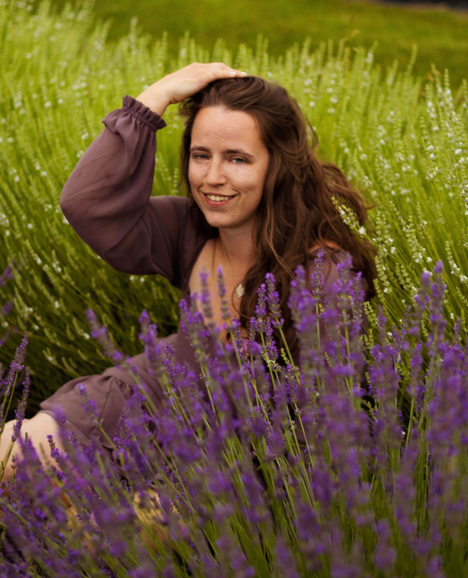 Candid moments captured in a field of purple lavender flowers during golden hour.