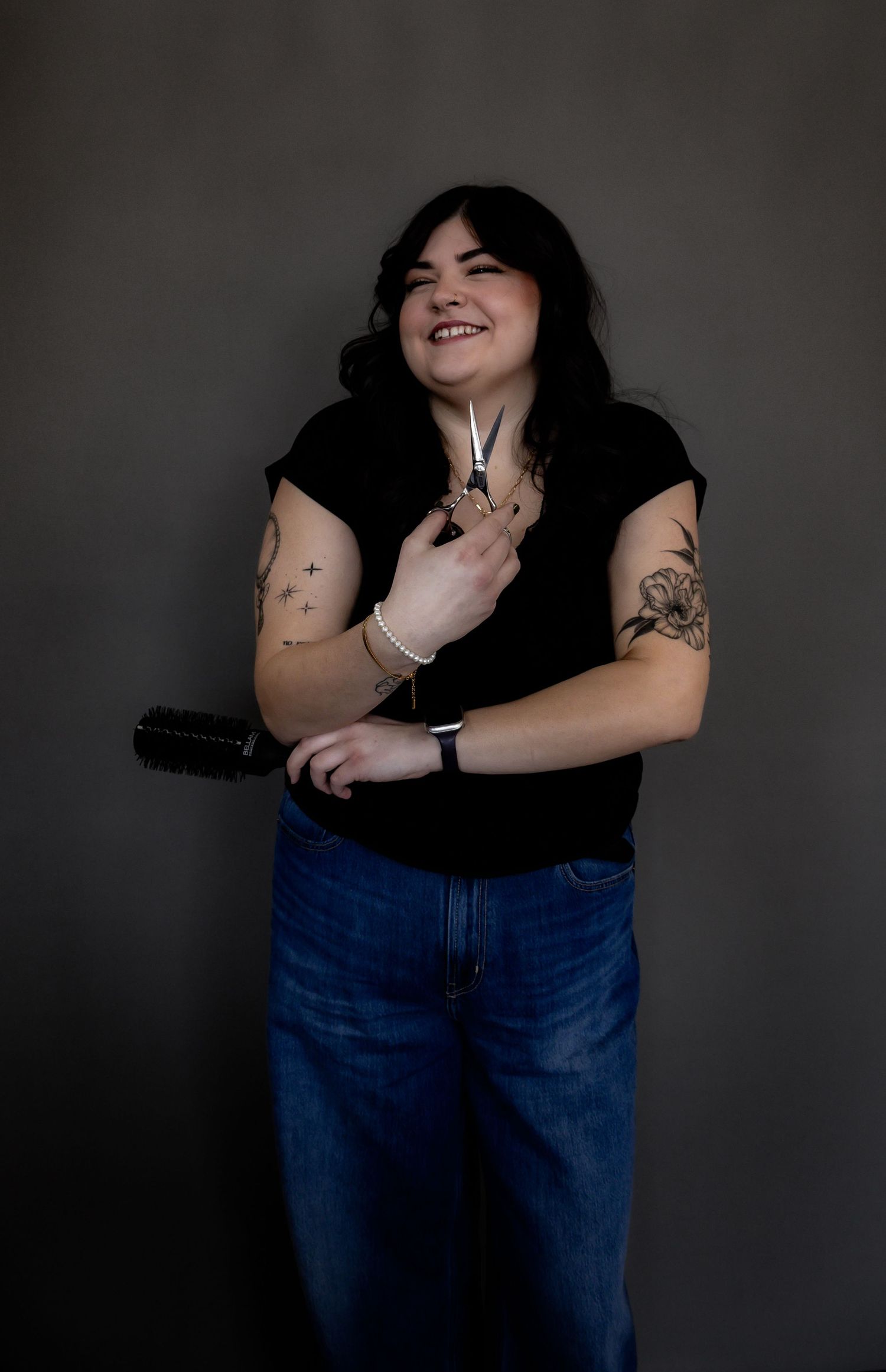 Moody portrait series against dark background showing casual poses in denim and black attire.