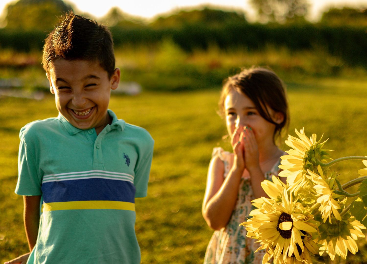 Bright sunflowers frame playful summer portrait session.