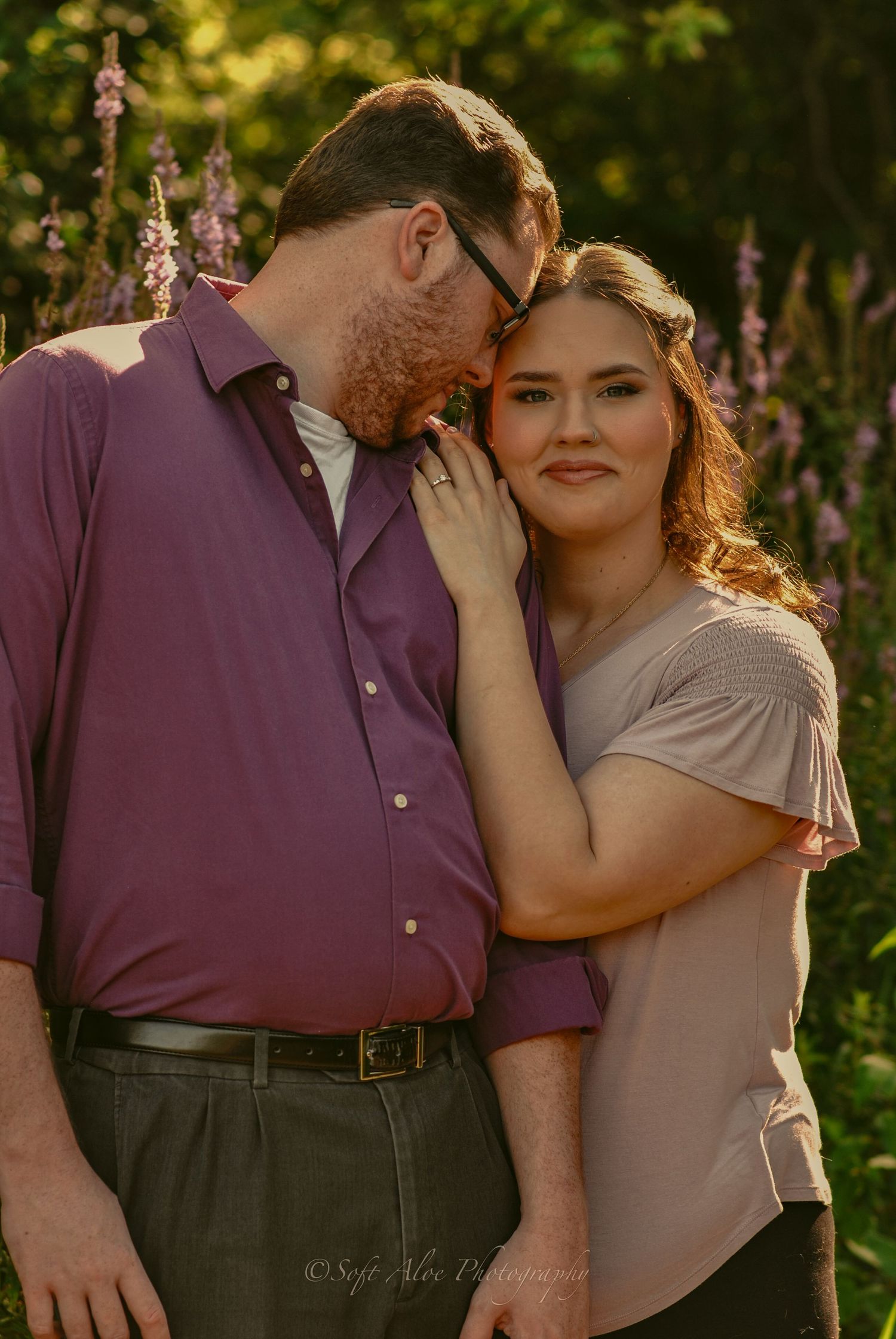 Romantic outdoor photoshoot sequence showing tender moments between a couple surrounded by blooming flowers at sunset.