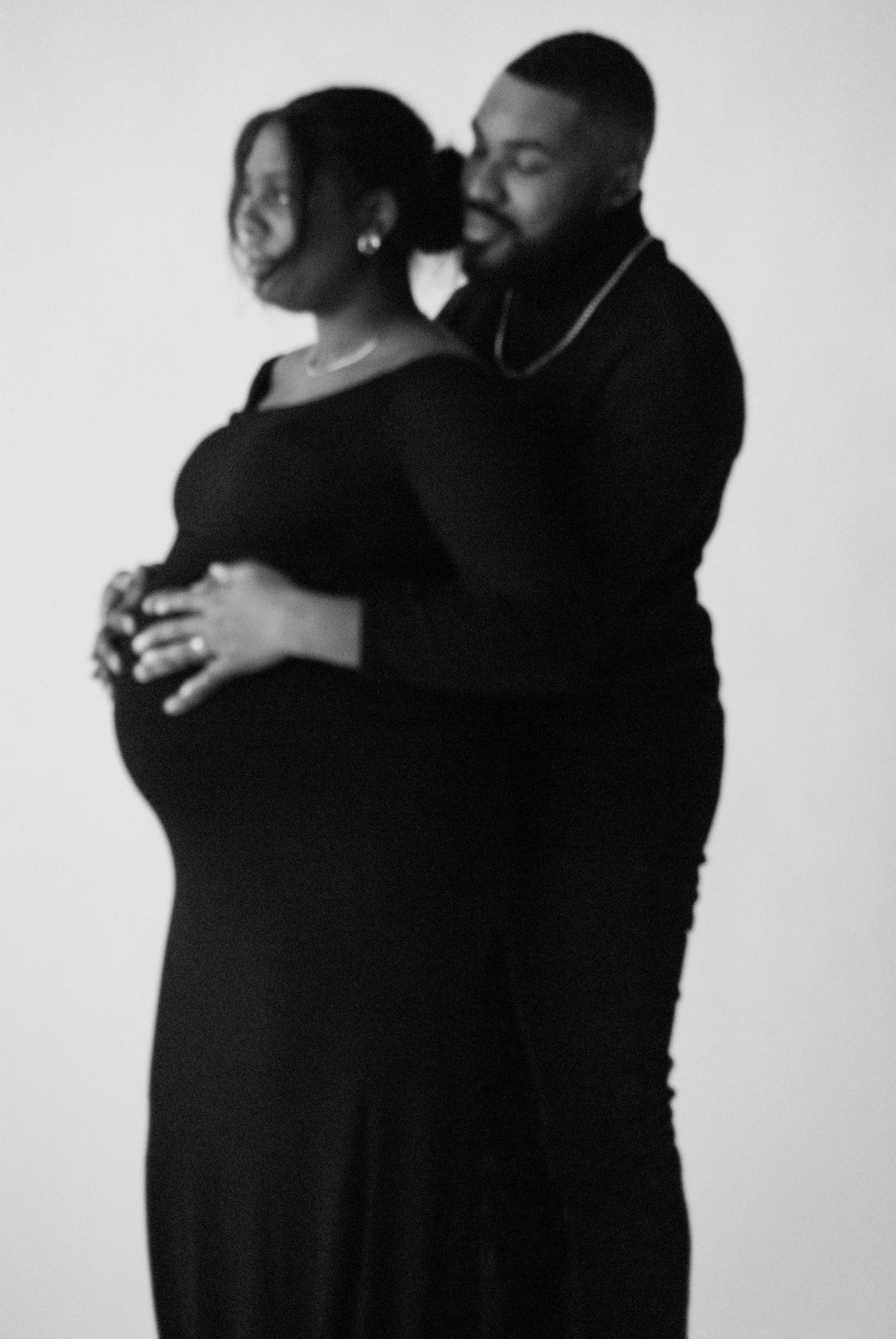A series of intimate black and white portraits showing a couple's tender moments together.