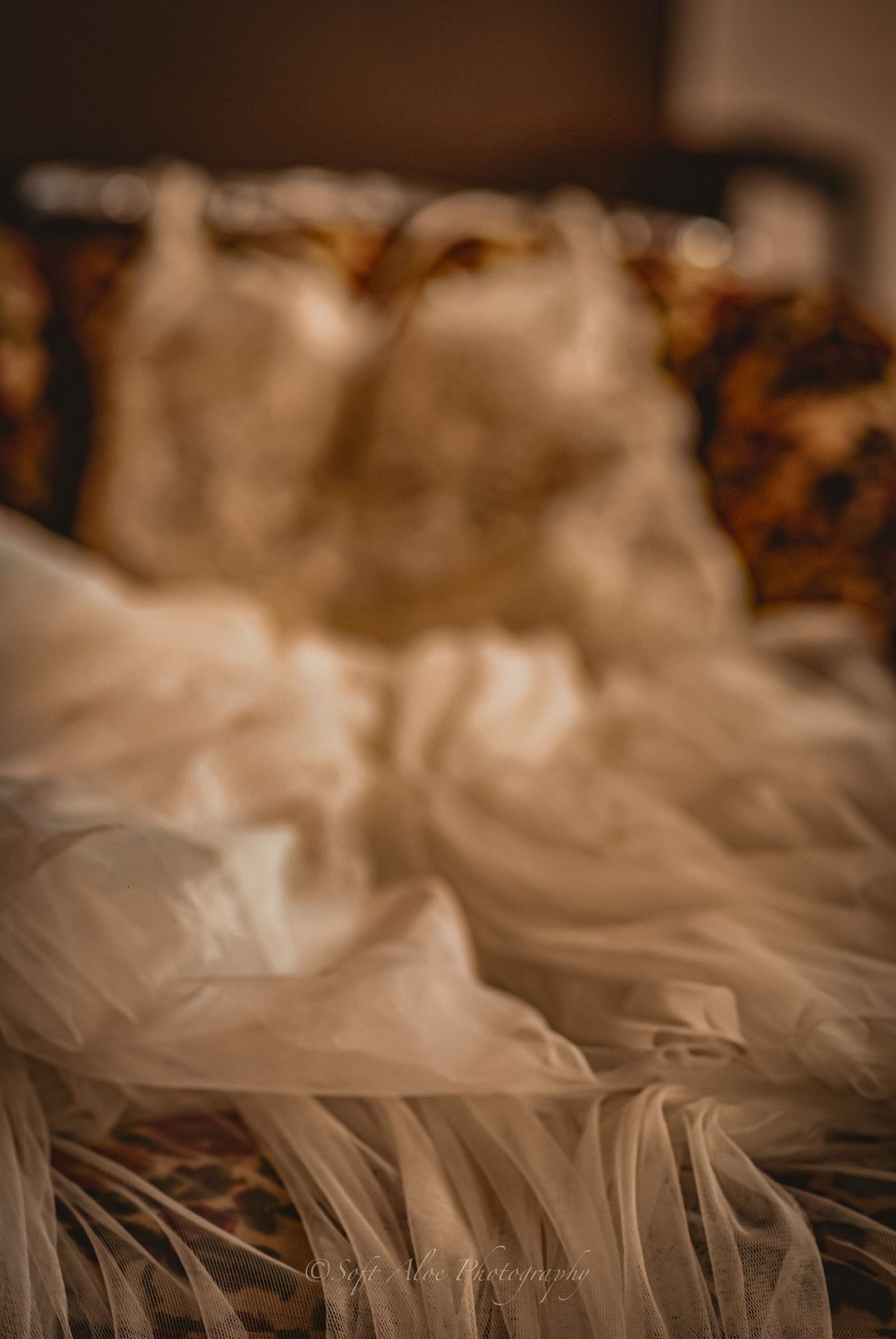 Close-up of delicate tulle wedding dress fabric with soft pleats and folds.