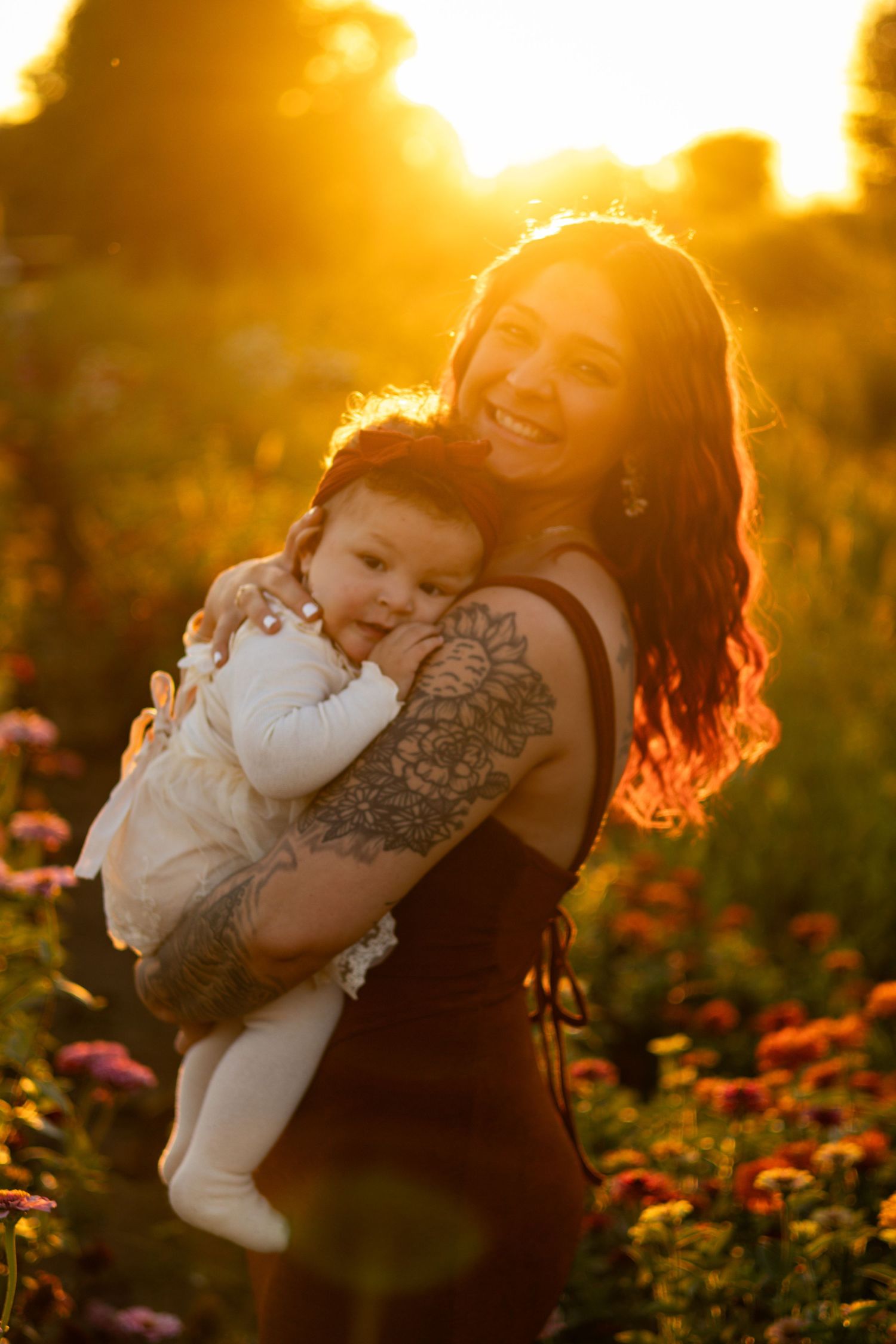 Warm sunset light illuminates a joyful moment in a blooming flower garden.