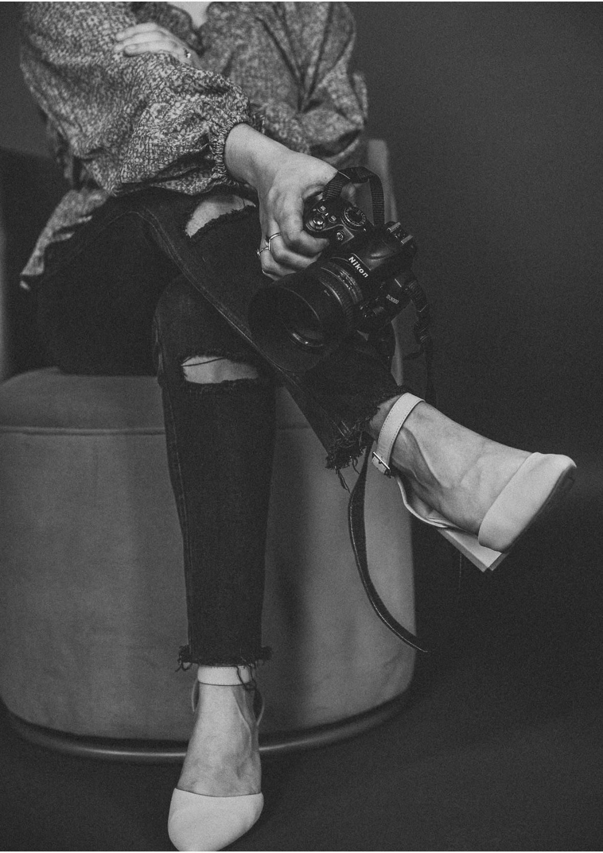 Black and white photos showing details of a person sitting in vintage-style clothing and shoes.