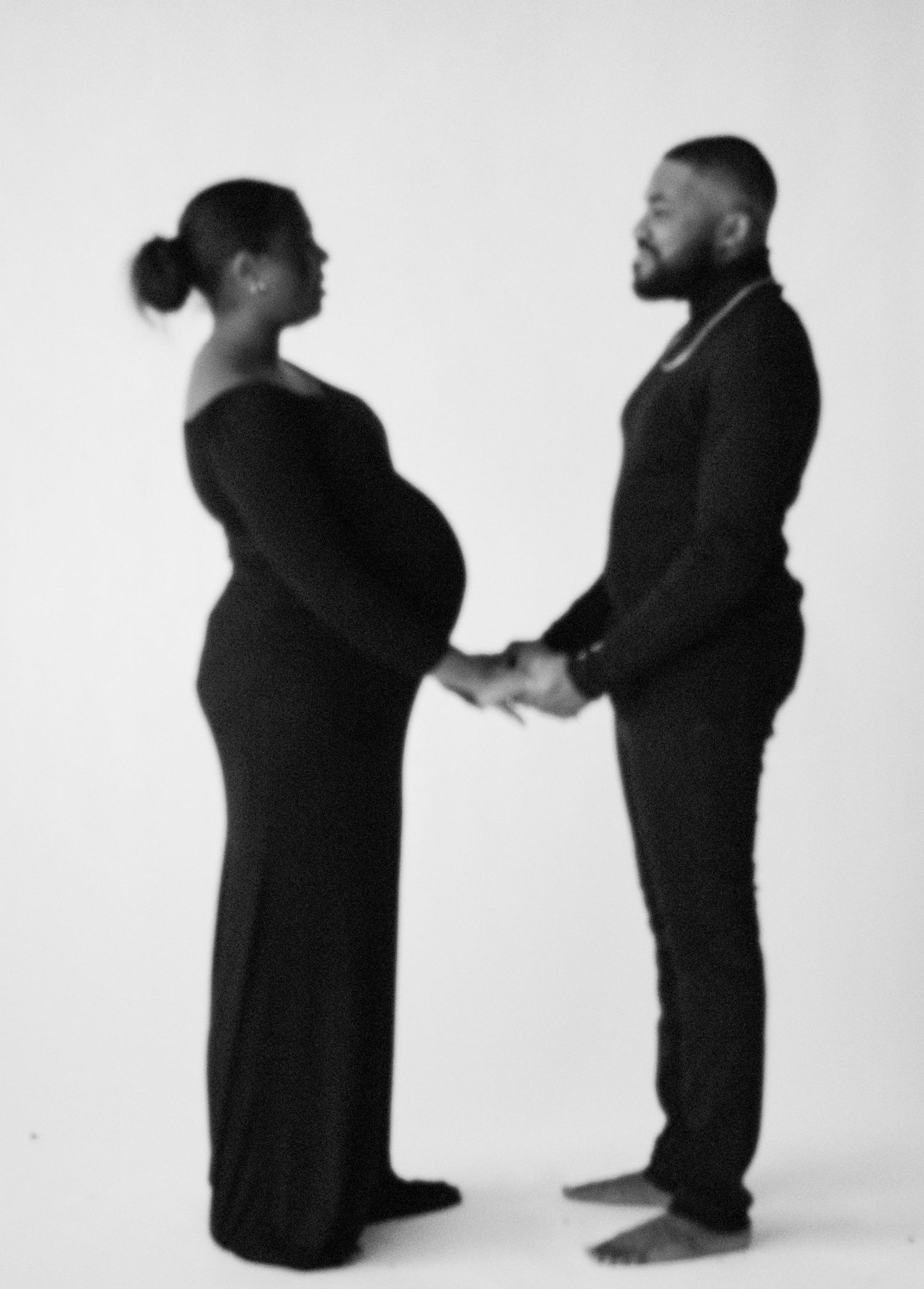 A series of silhouettes showing a couple embracing and dancing together against a white background.