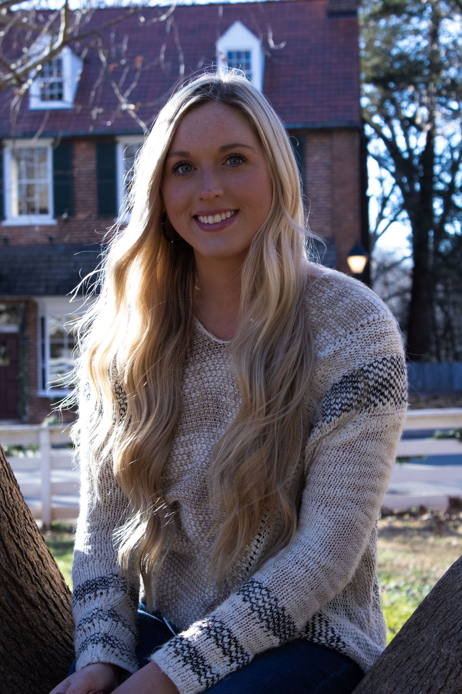 Winter portrait session with cream knit sweater and natural outdoor lighting.