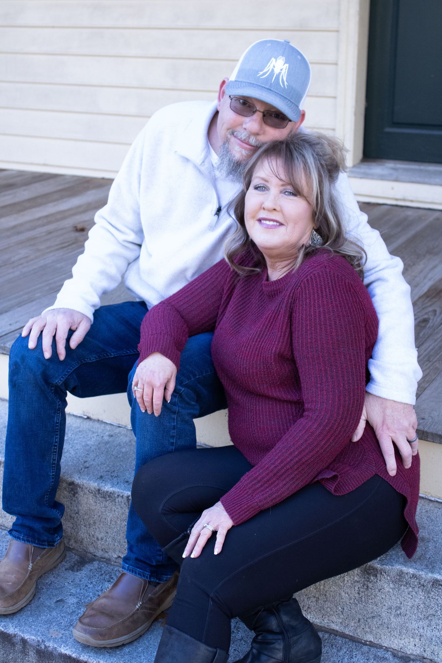 Casual outdoor family portraits on concrete steps with relaxed poses.