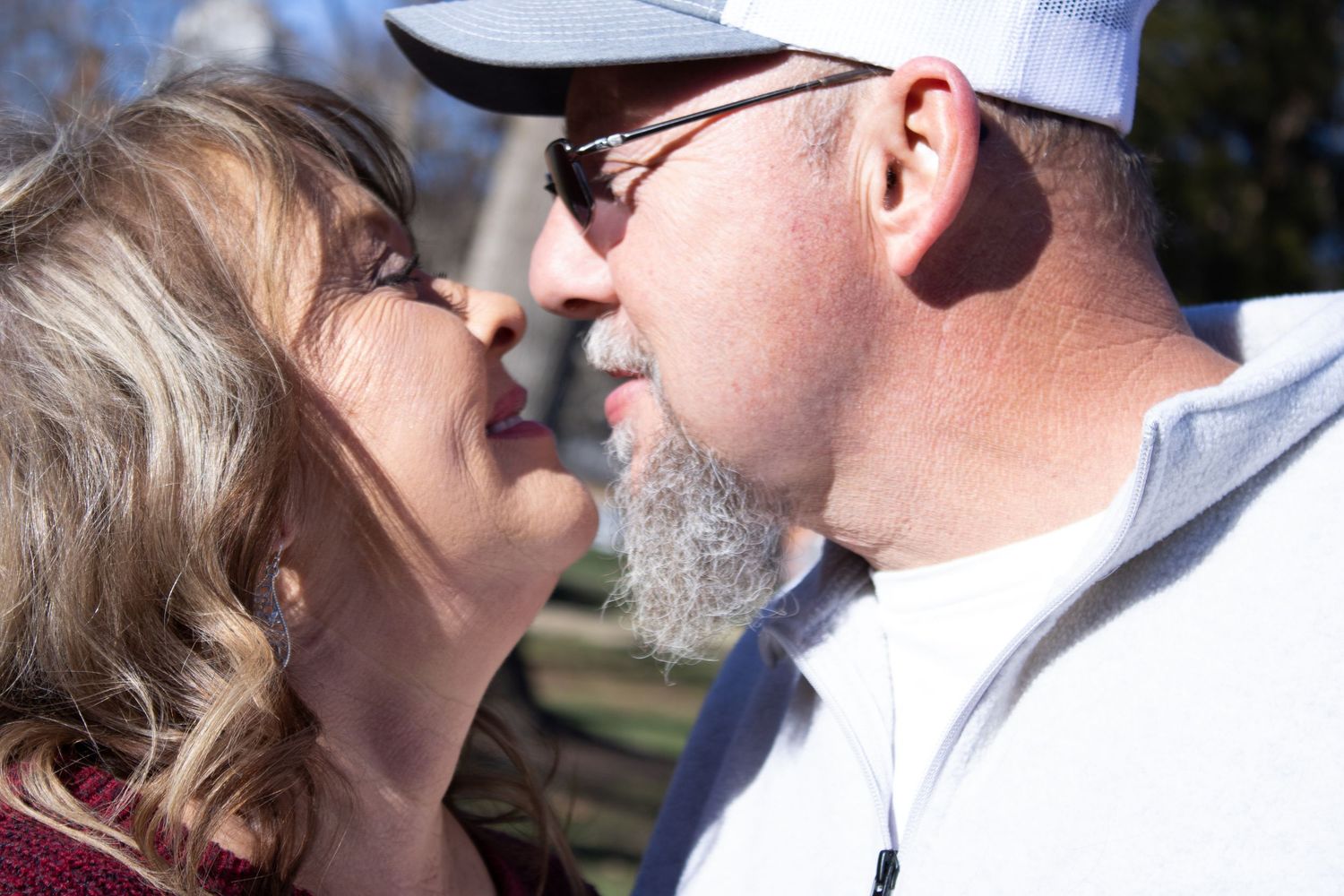 Intimate couple portraits captured in natural outdoor lighting.