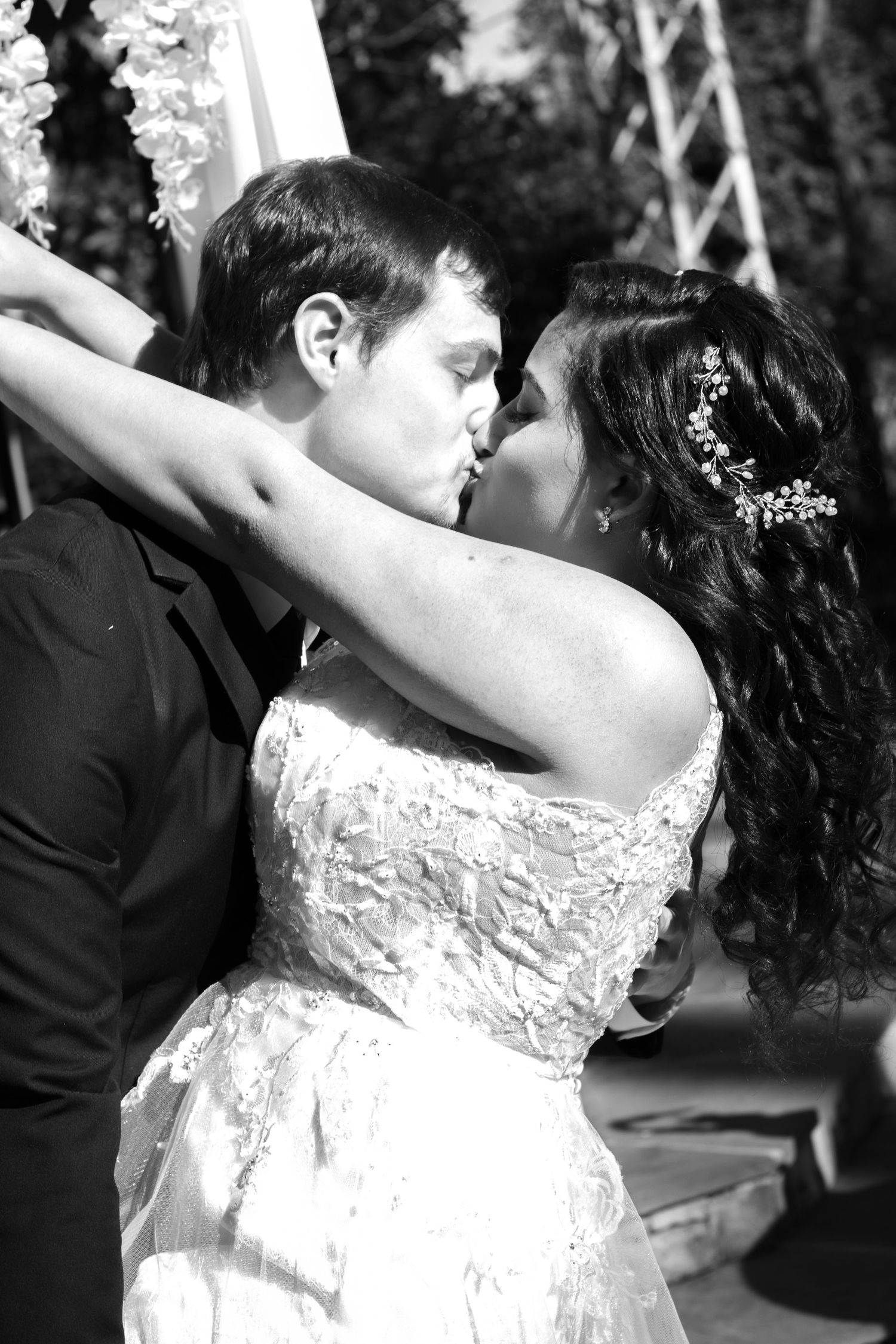 A romantic black and white portrait of a couple sharing their first dance at their wedding.
