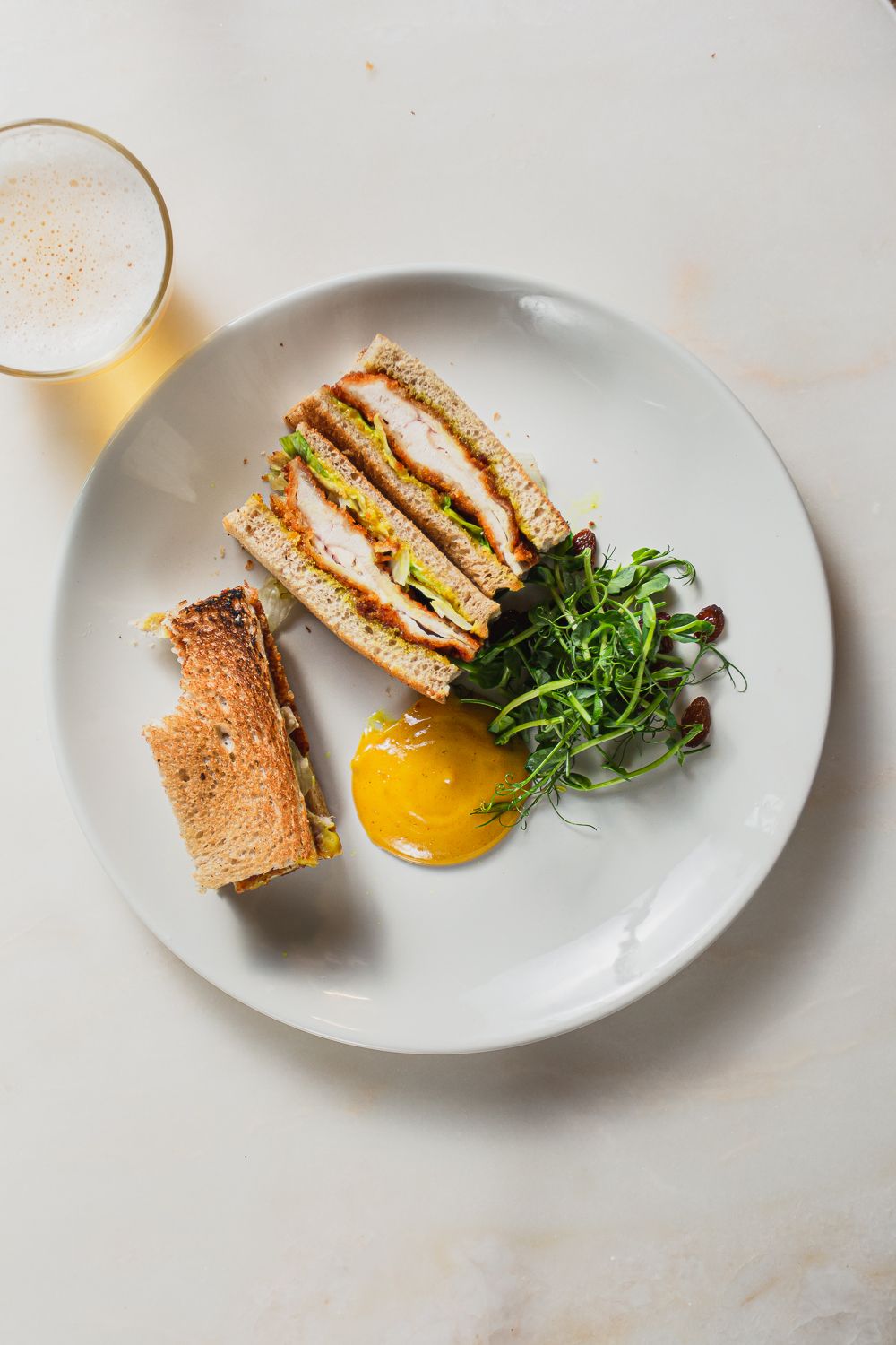 High end restaurant photography flatlay of a toastie with beer