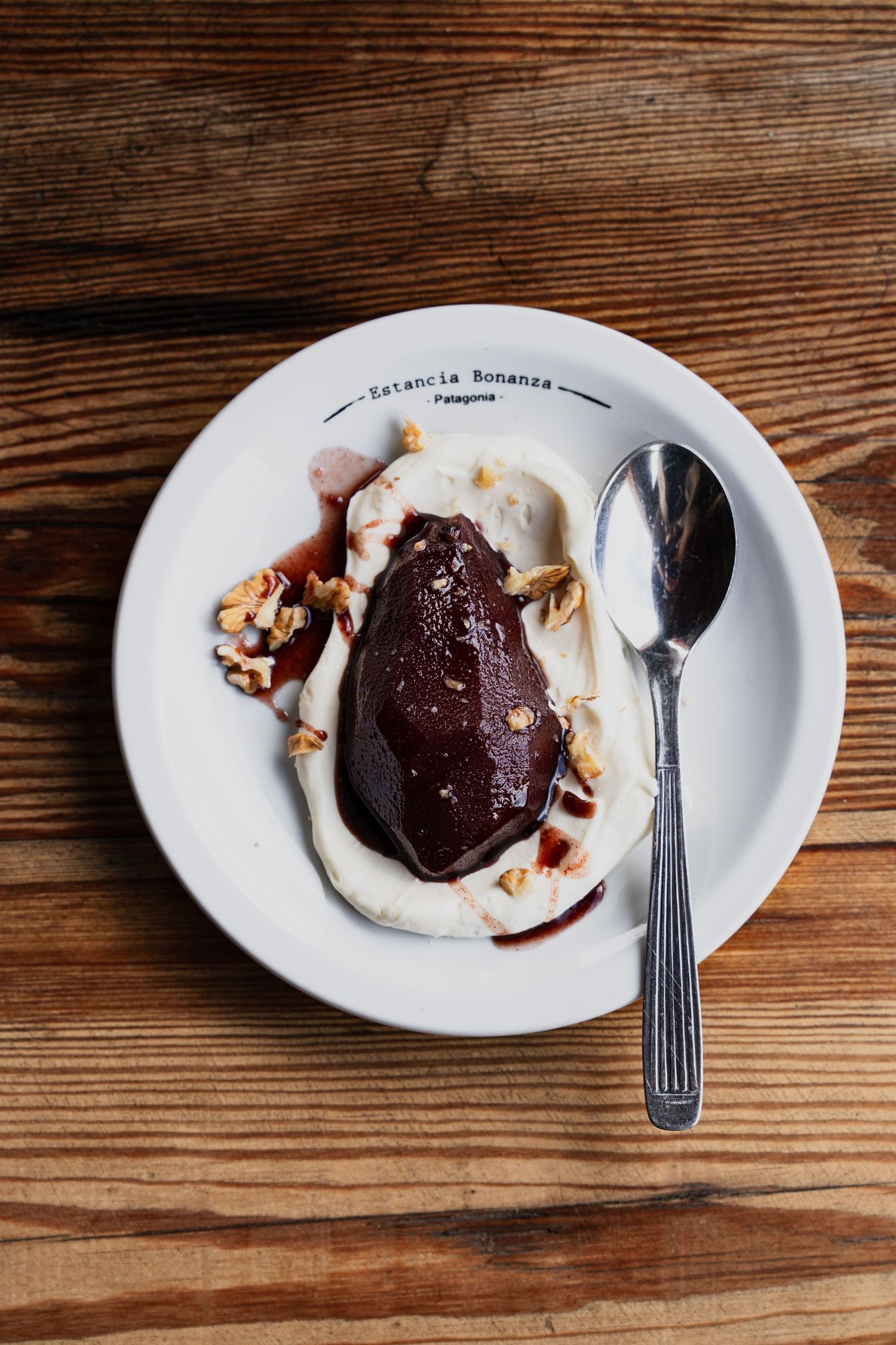 Restaurant photography red wine poached pears with cream