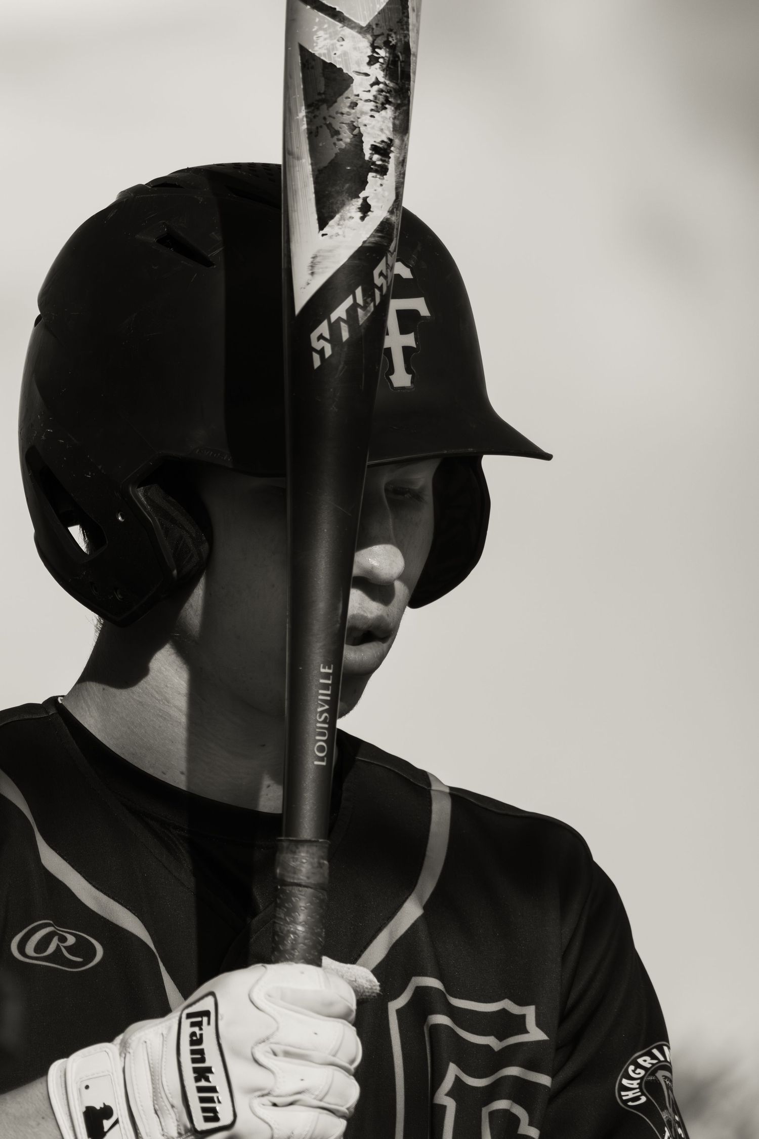 Close-up baseball batting portraits showing equipment and stance details against light background.