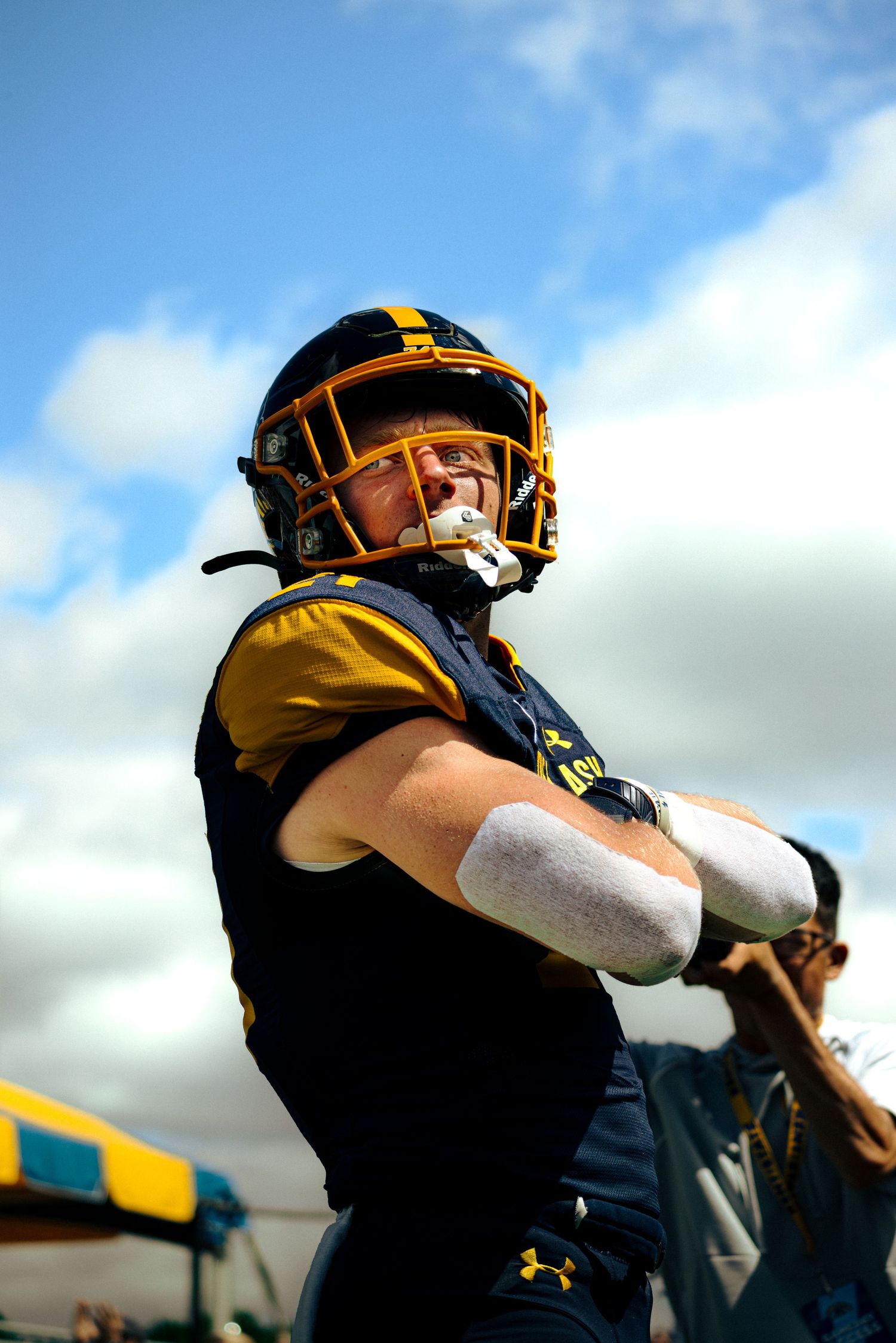 A sequence showing a baseball catcher making quick side movements while wearing protective gear behind home plate.